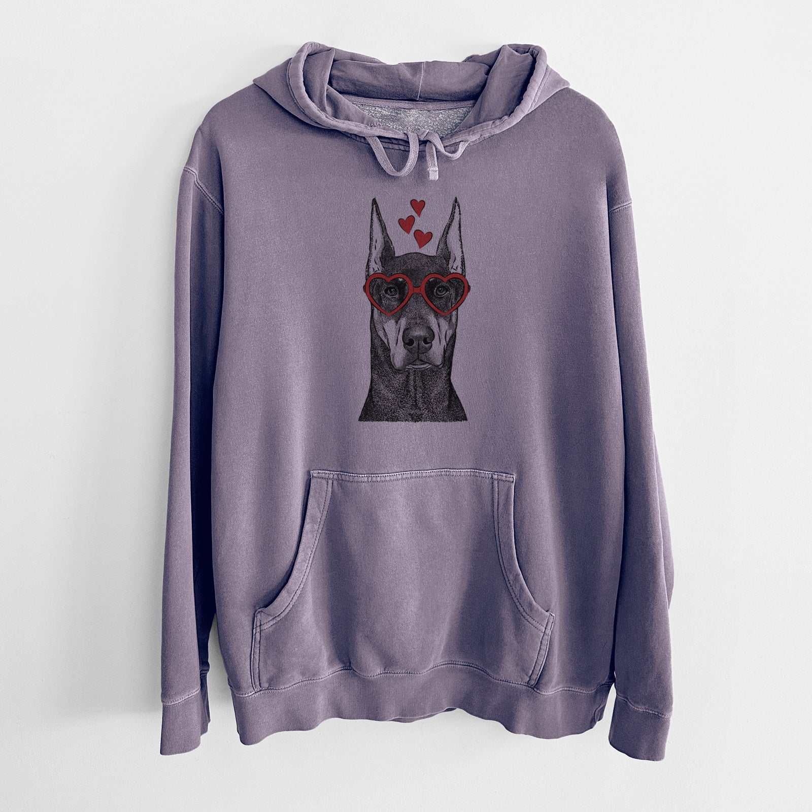 Hand-drawn sketch of Drake the Doberman Pinscher wearing heart-shaped glasses on a Plum Unisex pigment dyed hoodie
