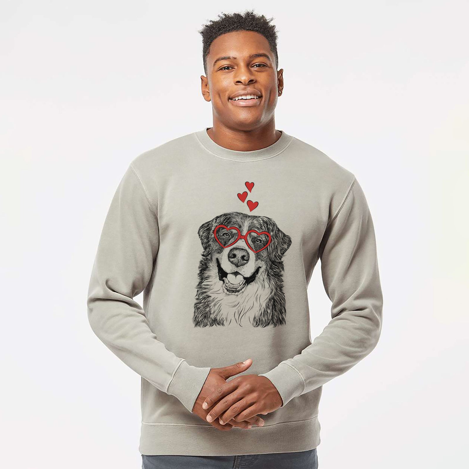 Hand-drawn sketch of Eiger the Bernese Mountain Dog wearing heart-shaped glasses on a Cement Unisex pigment dyed crew sweatshirt
