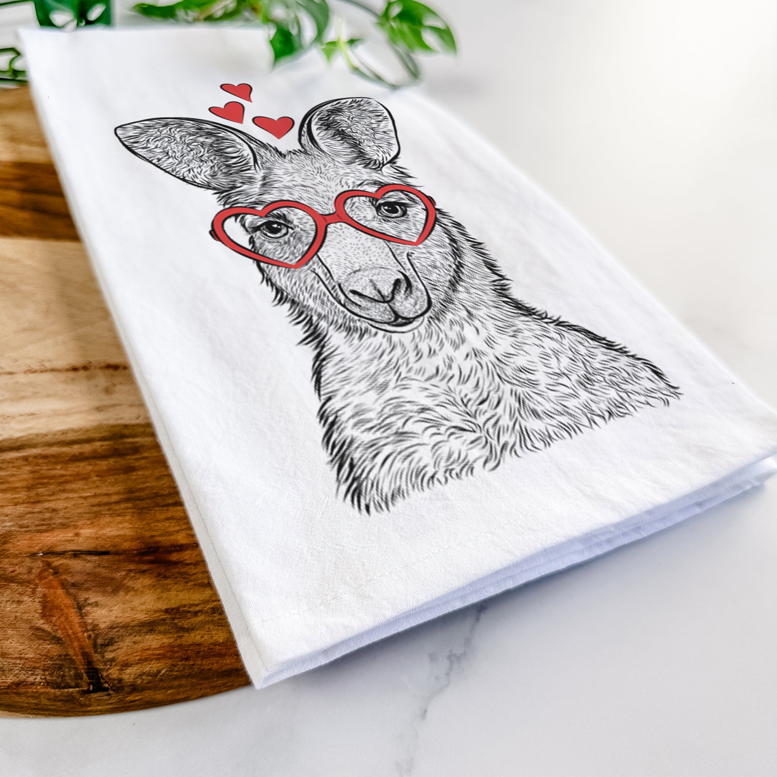 Hand-drawn sketch of Evelyn the Eastern Grey Kangaroo wearing heart-shaped glasses on a tea towel