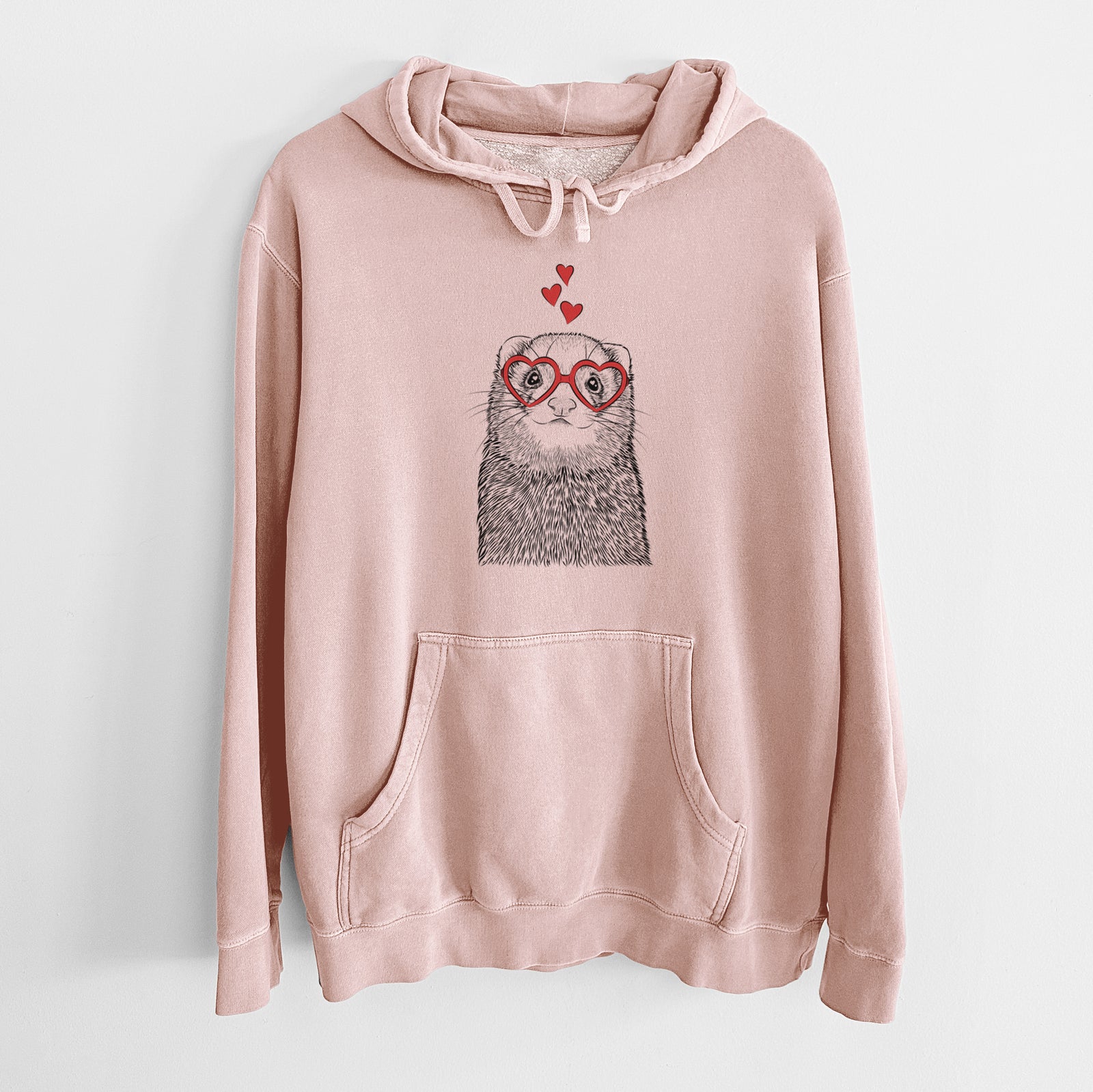 Hand-drawn sketch of Fig the Ferret wearing heart-shaped glasses on a Dusty Pink Unisex pigment dyed hoodie