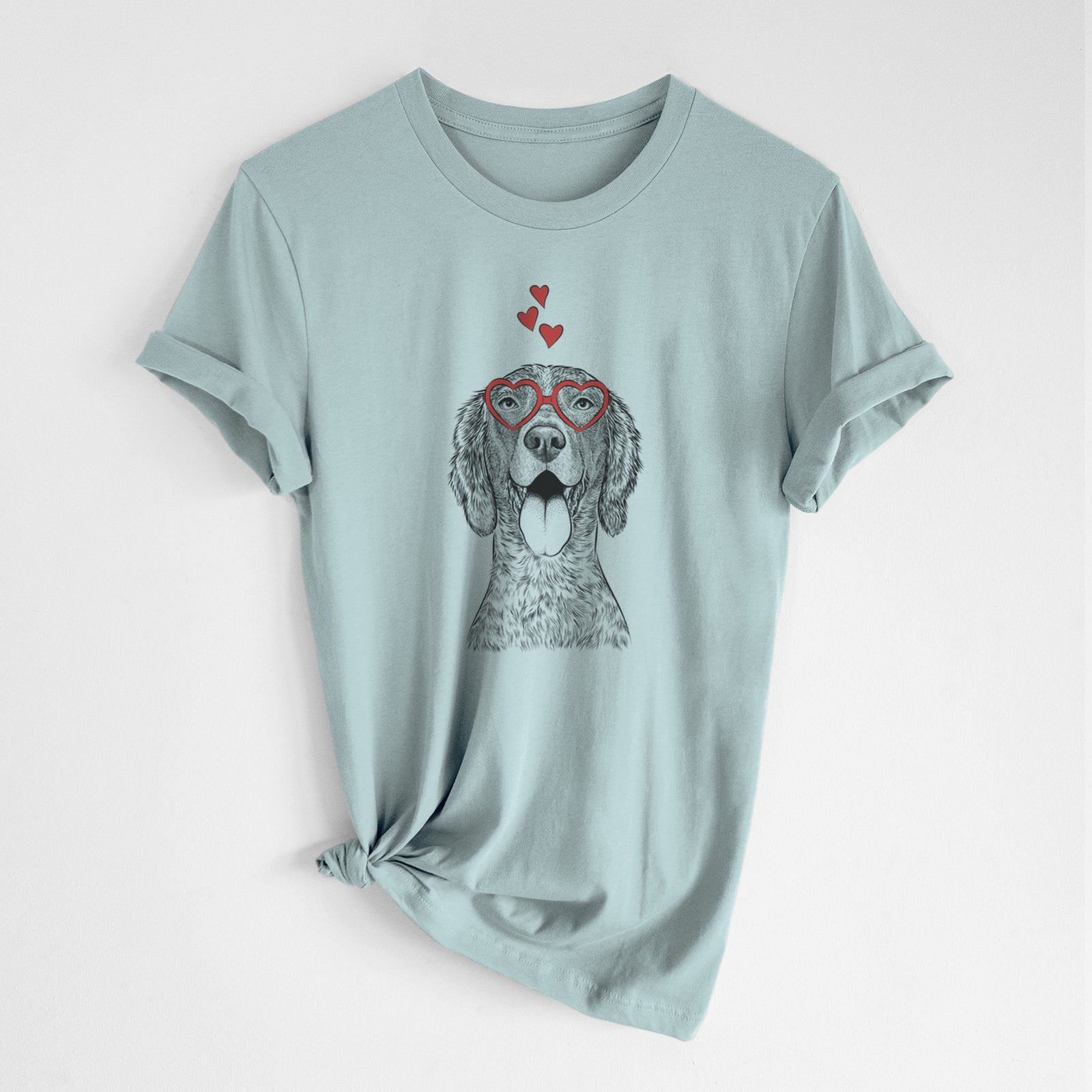 Hand-drawn sketch of Freddy the English Setter wearing heart-shaped glasses on a Dusty Blue Unisex crewneck, worn by a woman