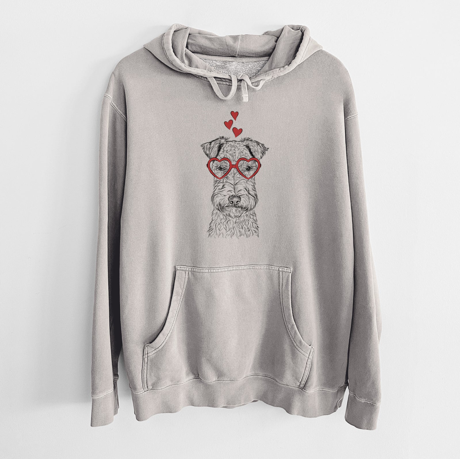 Hand-drawn sketch of Frida the Lakeland Terrier wearing heart-shaped glasses on a Cement Unisex pigment dyed hoodie