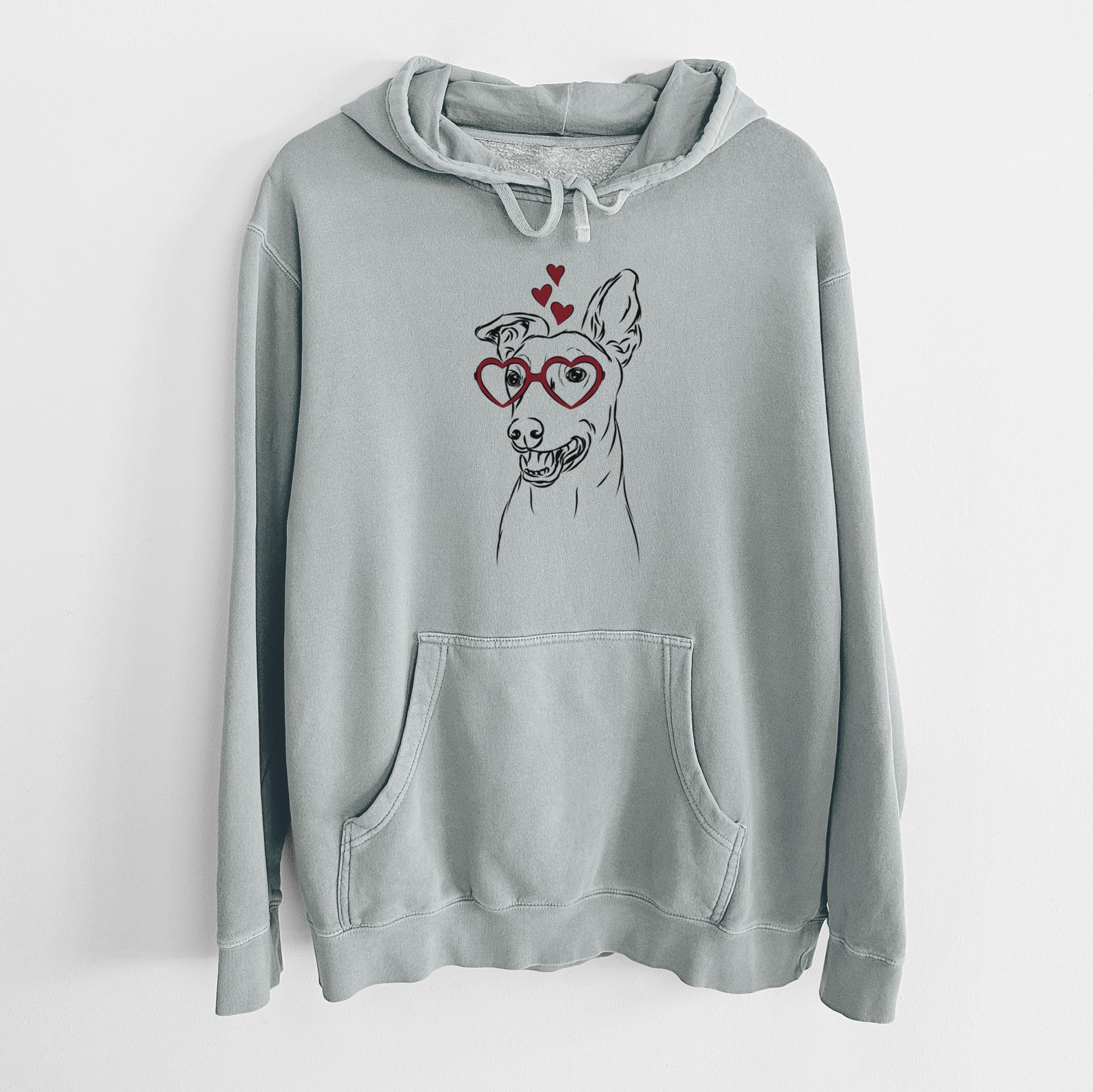 Hand-drawn sketch of Frosty the Greyhound the Greyhound wearing heart-shaped glasses on a Sage Unisex pigment dyed hoodie