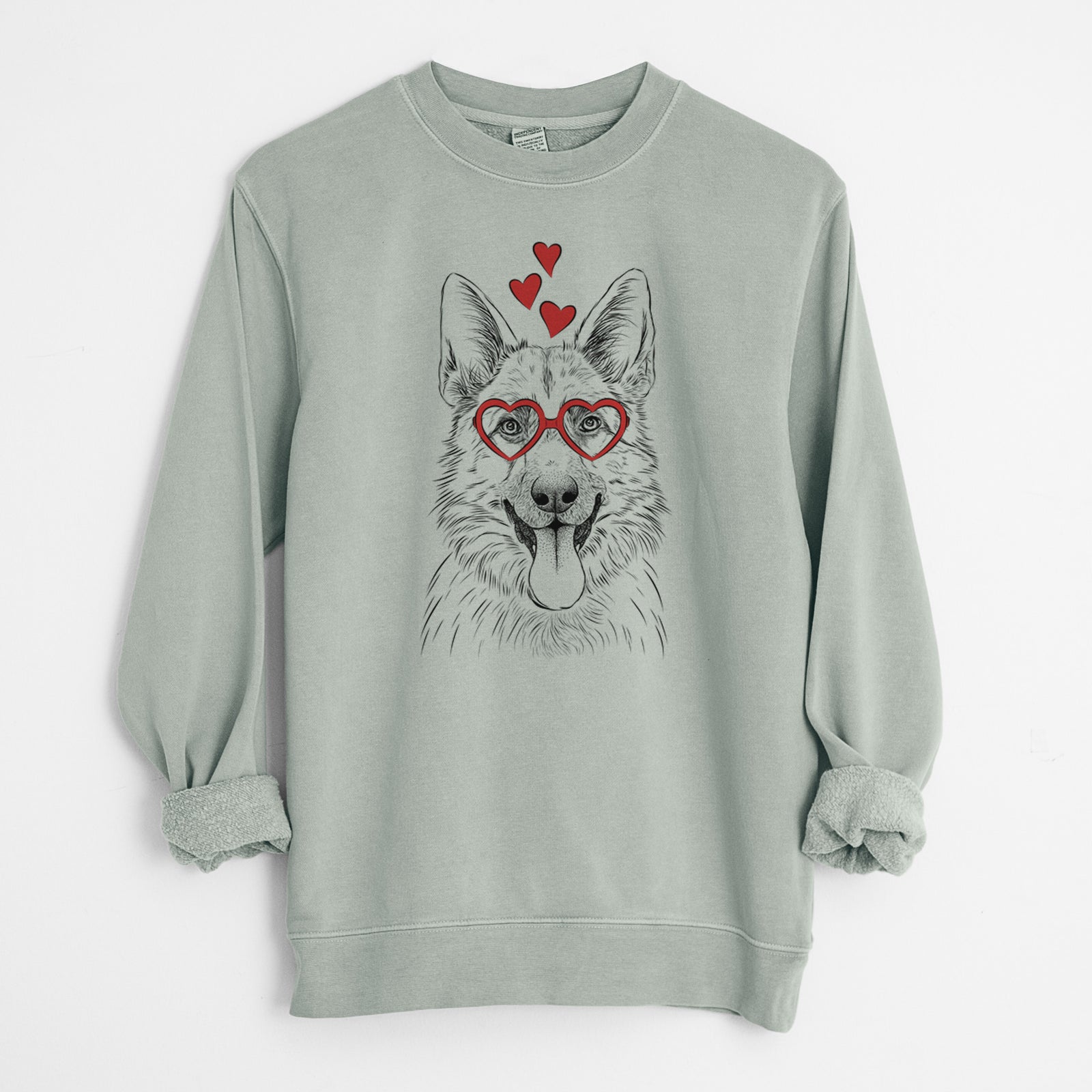 Hand-drawn sketch of Grace the German Shepherd wearing heart-shaped glasses on a Sage Unisex pigment dyed crew sweatshirt