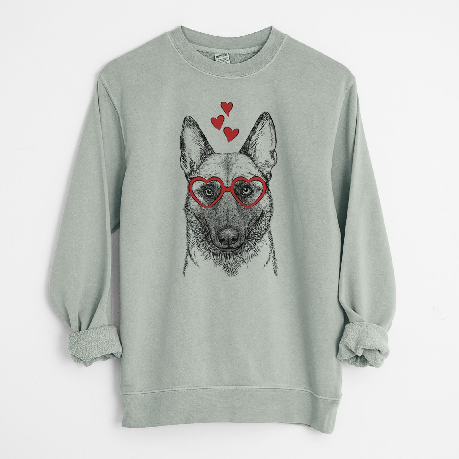 Hand-drawn sketch of Gunther the Belgian Malinois wearing heart-shaped glasses on a Sage Unisex pigment dyed crew sweatshirt