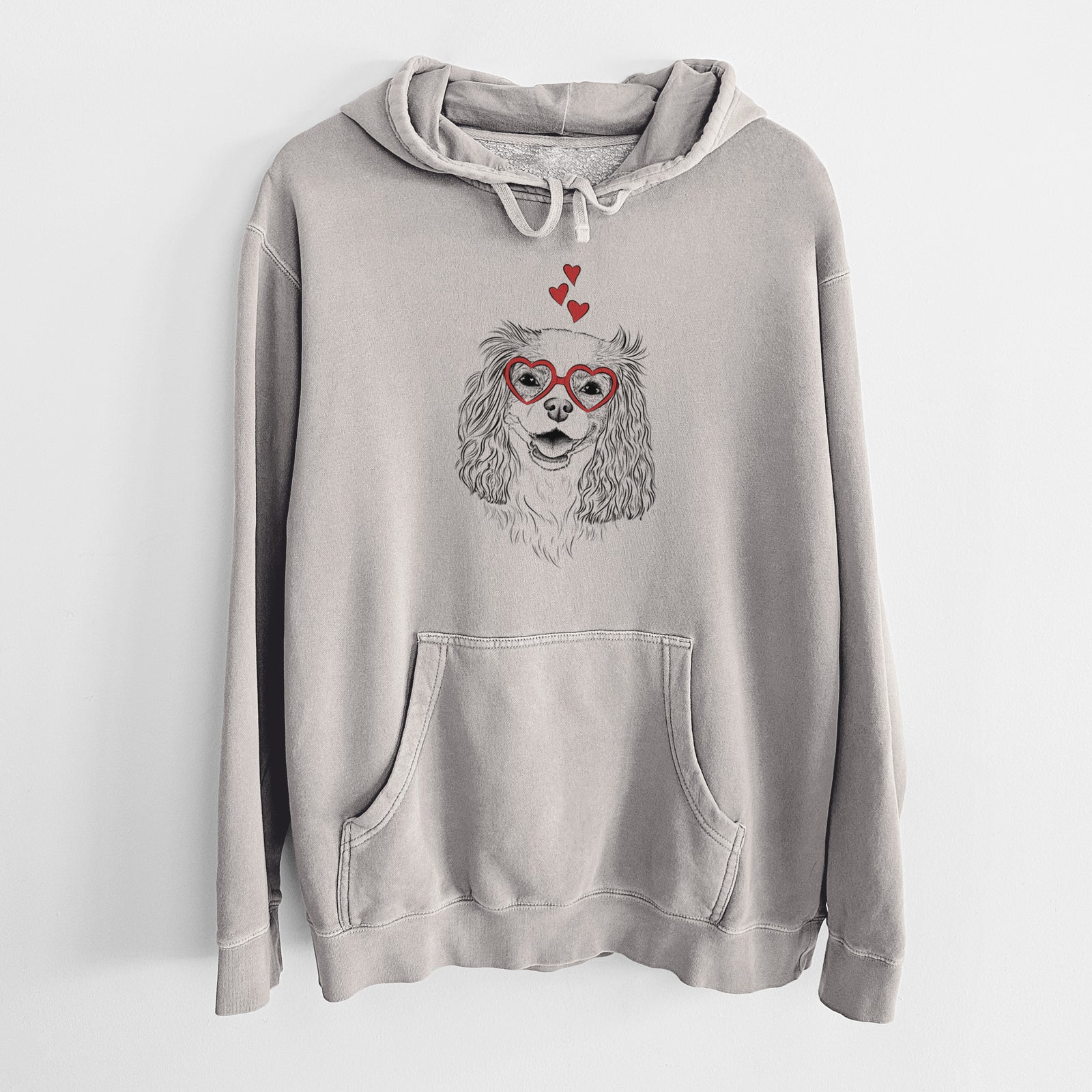 Hand-drawn sketch of Halley Comet the Cavalier King Charles Spaniel wearing heart-shaped glasses on a Cement Unisex pigment dyed hoodie