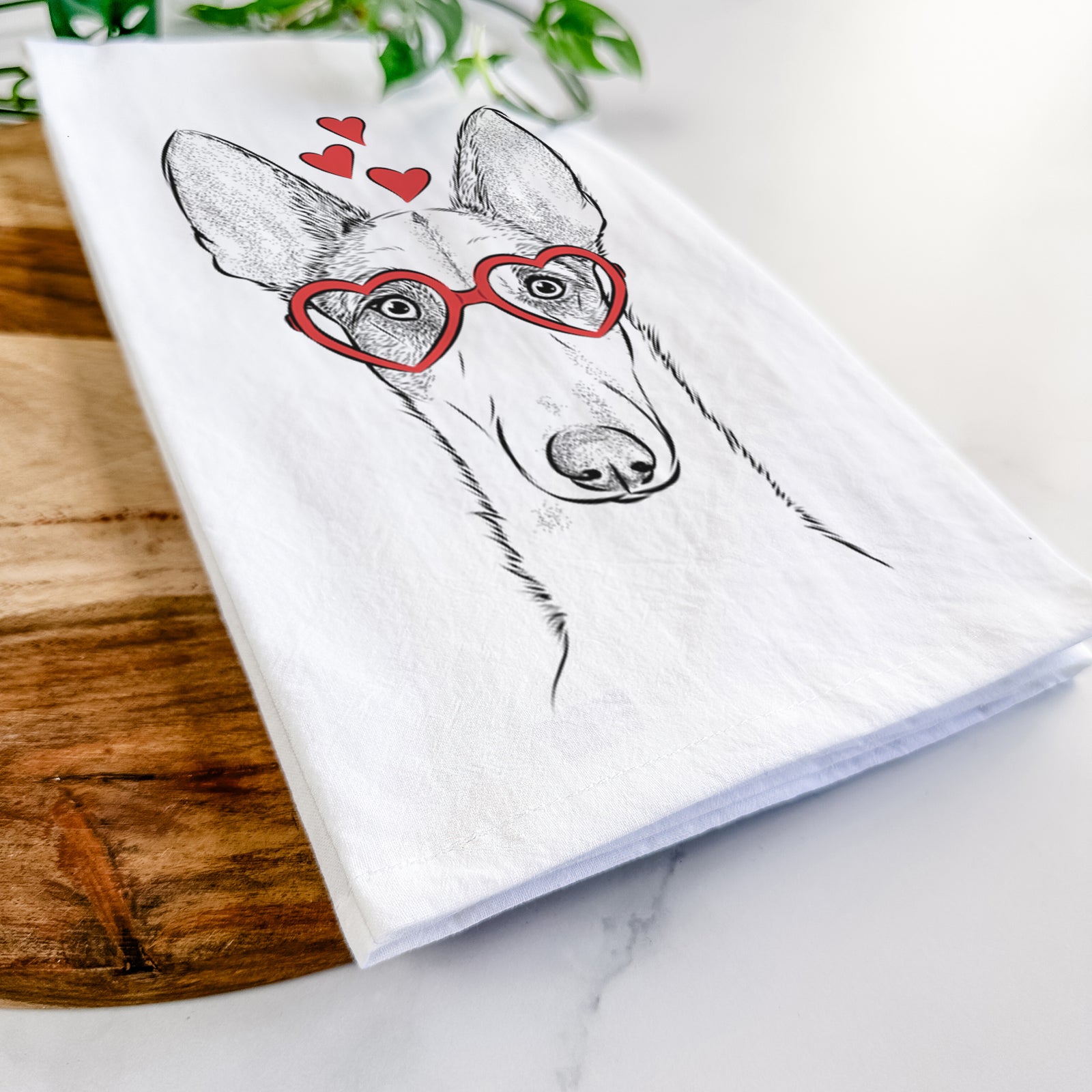Hand-drawn sketch of Halo the Ibizan Sight Hound wearing heart-shaped glasses on a tea towel