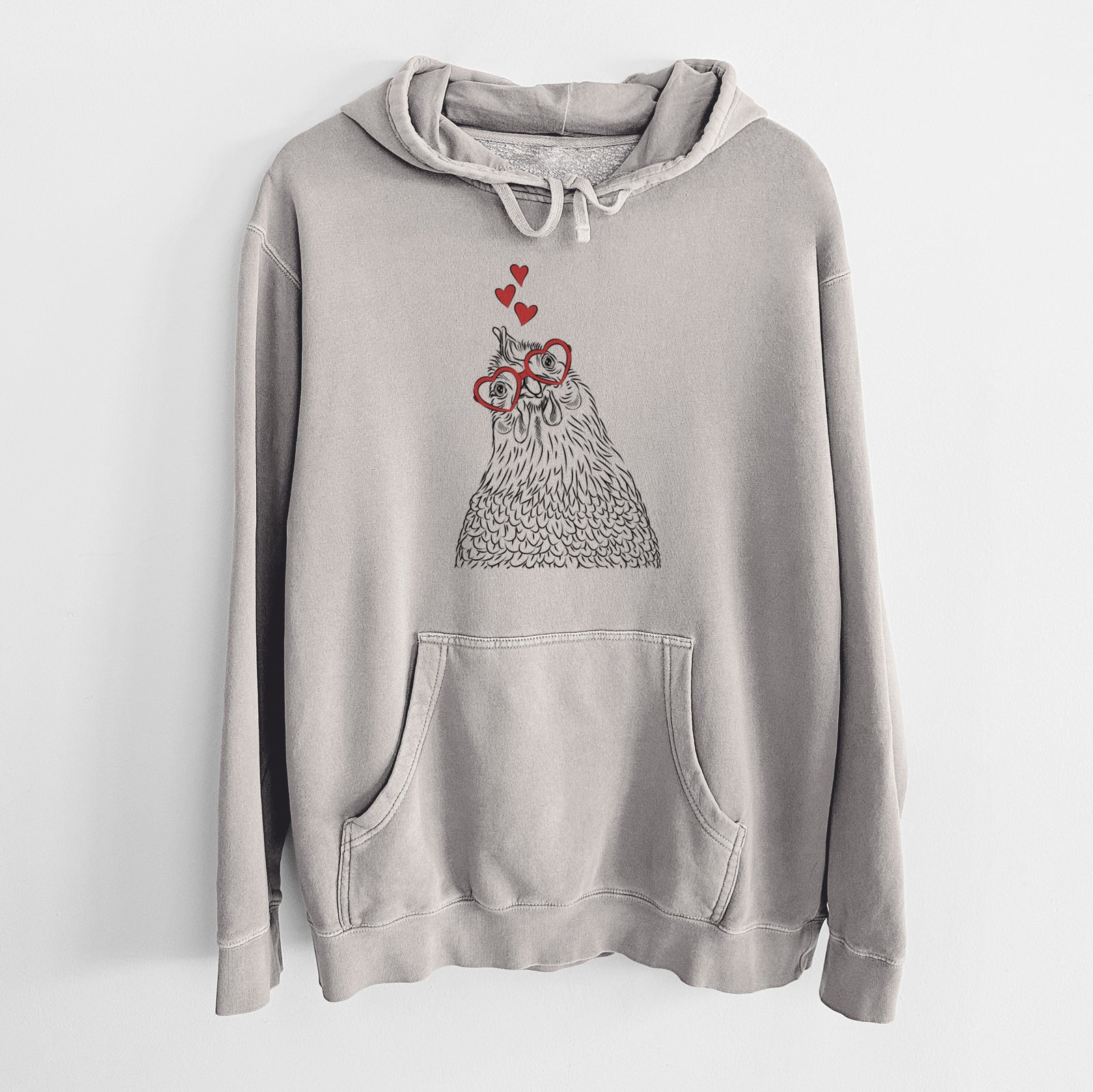 Hand-drawn sketch of Henrietta the Chicken wearing heart-shaped glasses on a Cement Unisex pigment dyed hoodie