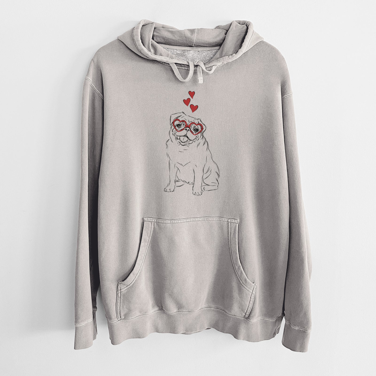 Hand-drawn sketch of Higgins the Pug wearing heart-shaped glasses on a Cement Unisex pigment dyed hoodie