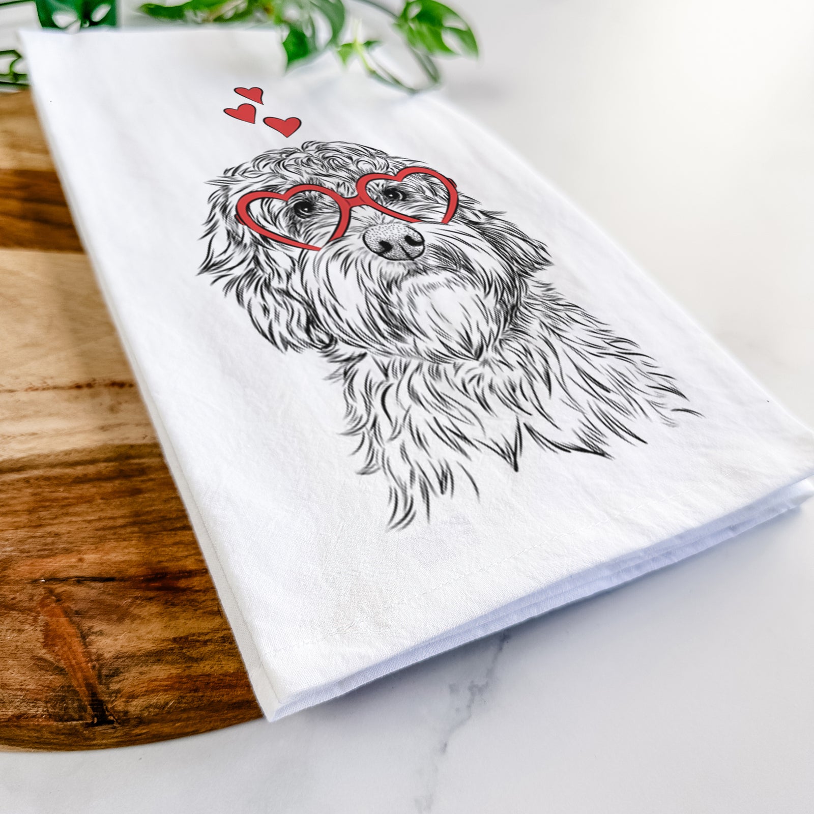 Hand-drawn sketch of Huckleberry the Australian Labradoodle wearing heart-shaped glasses on a tea towel