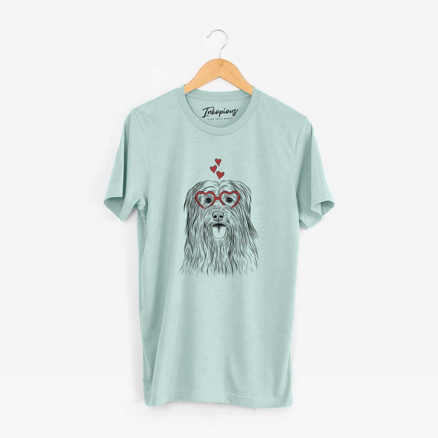 Hand-drawn sketch of Indy the Korean Sapsali wearing heart-shaped glasses on a Heather Sage Unisex crewneck