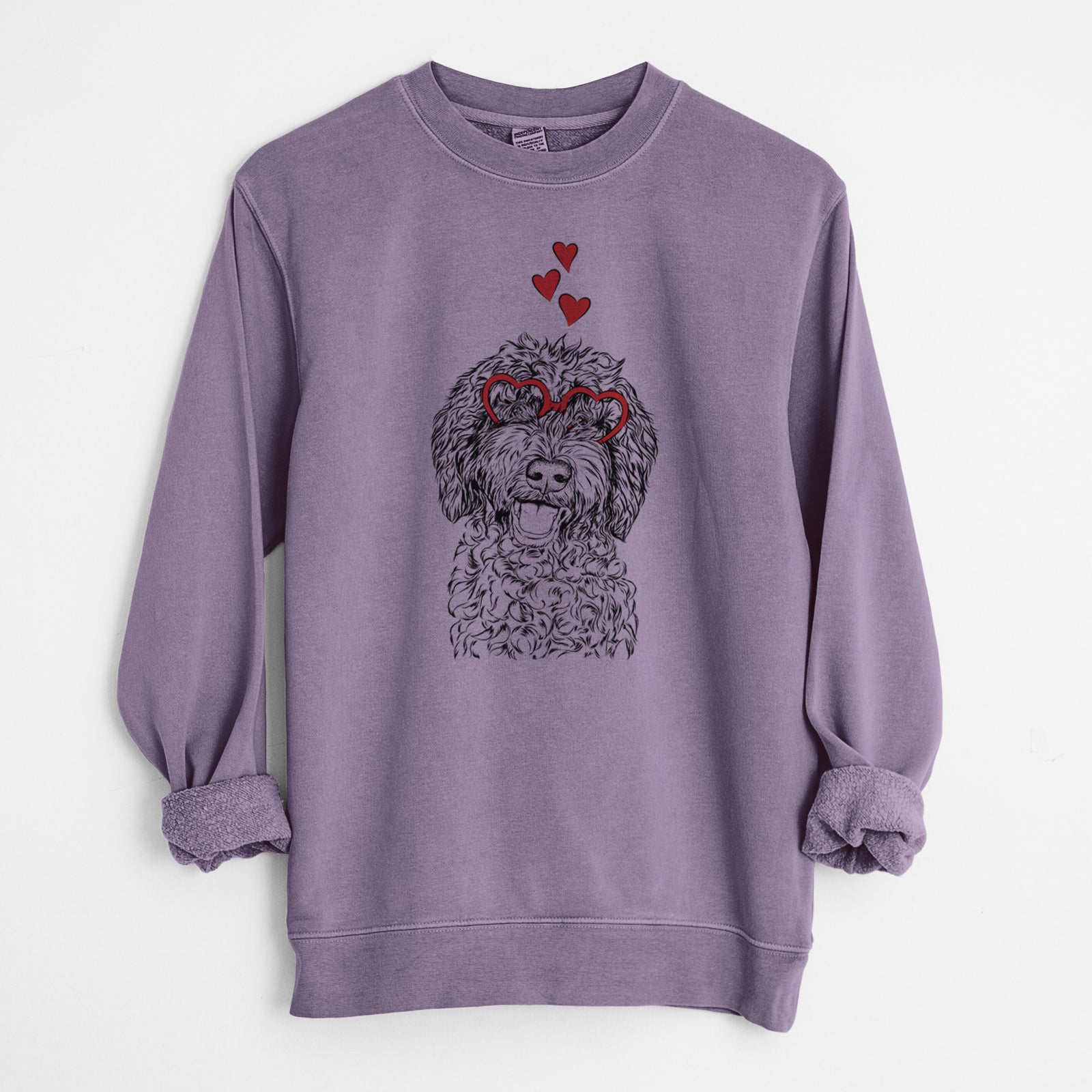 Hand-drawn sketch of Jack the Chocolate Labradoodle wearing heart-shaped glasses on a Plum Unisex pigment dyed crew sweatshirt