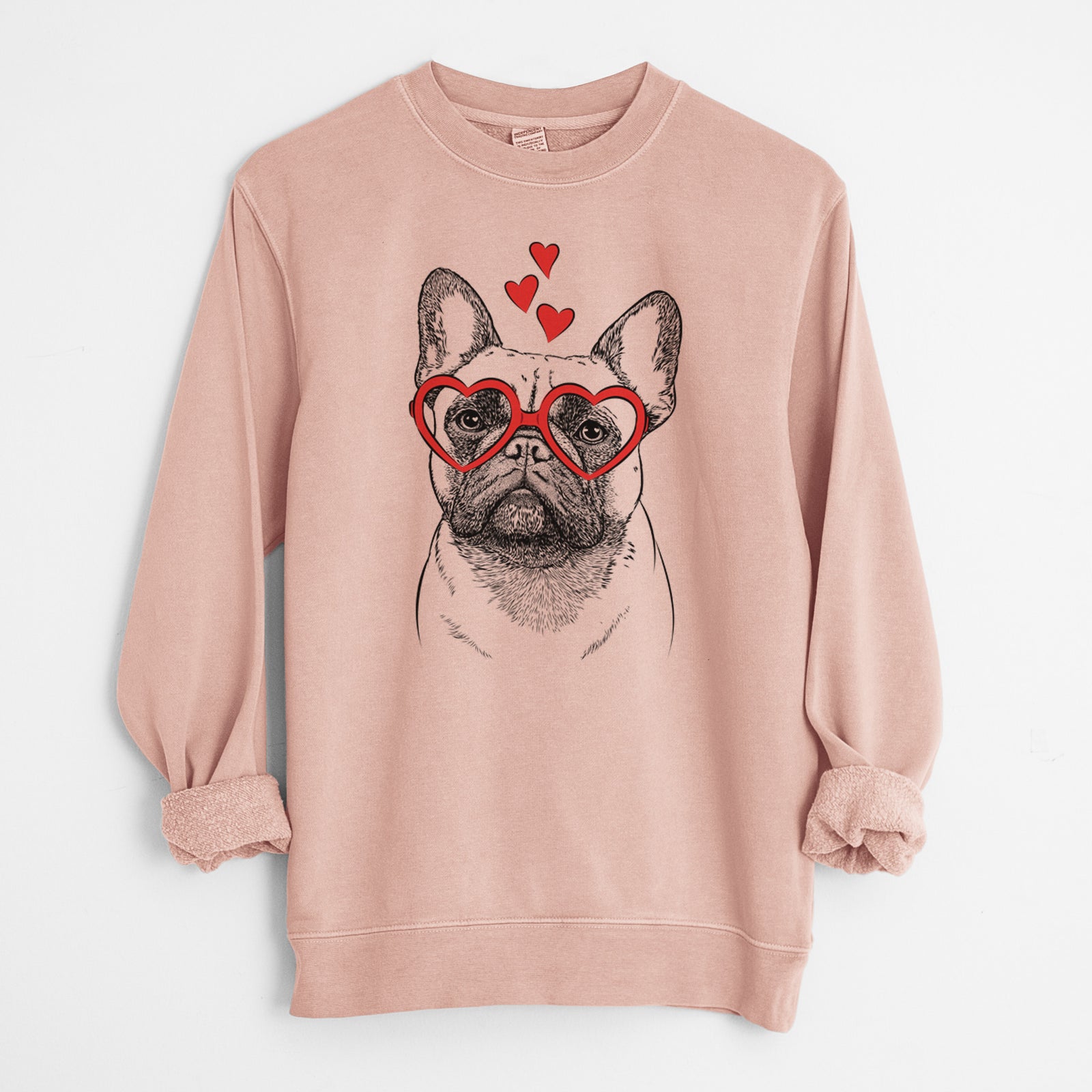 Hand-drawn sketch of Kingsleigh the French Bulldog wearing heart-shaped glasses on a Dusty Pink Unisex pigment dyed crew sweatshirt