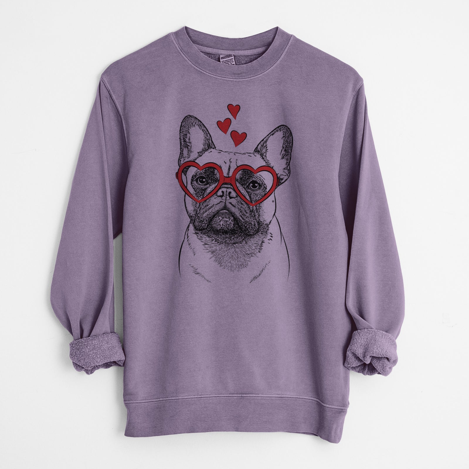 Hand-drawn sketch of Kingsleigh the French Bulldog wearing heart-shaped glasses on a Plum Unisex pigment dyed crew sweatshirt