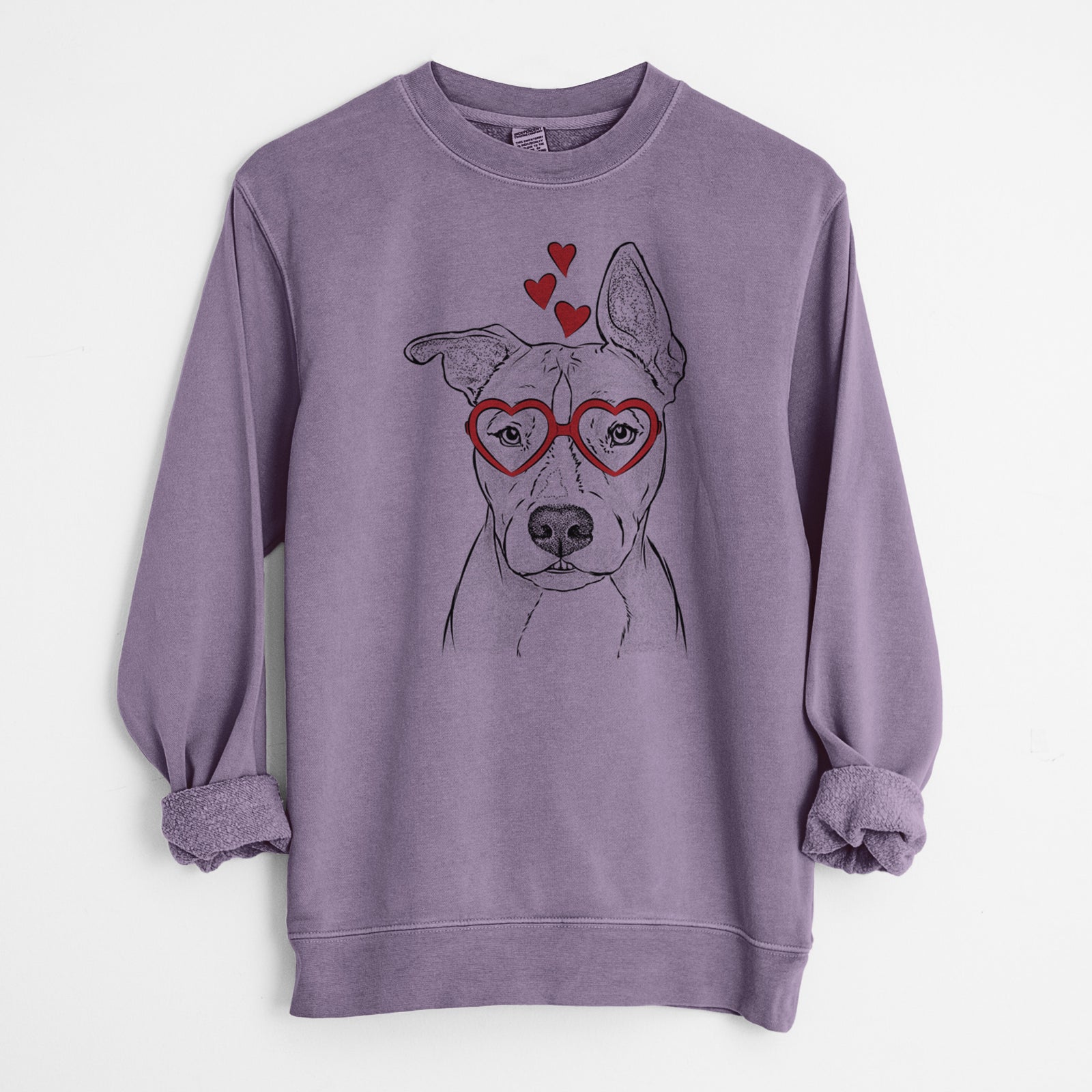 Hand-drawn sketch of Kisses the Pitbull wearing heart-shaped glasses on a Plum Unisex pigment dyed crew sweatshirt
