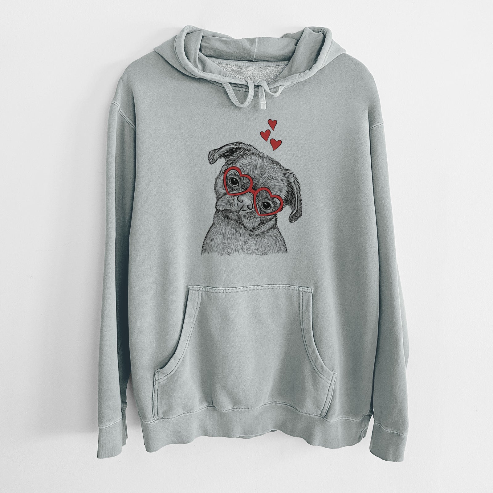 Hand-drawn sketch of Koko the Shih Tzu wearing heart-shaped glasses on a Sage Unisex pigment dyed hoodie