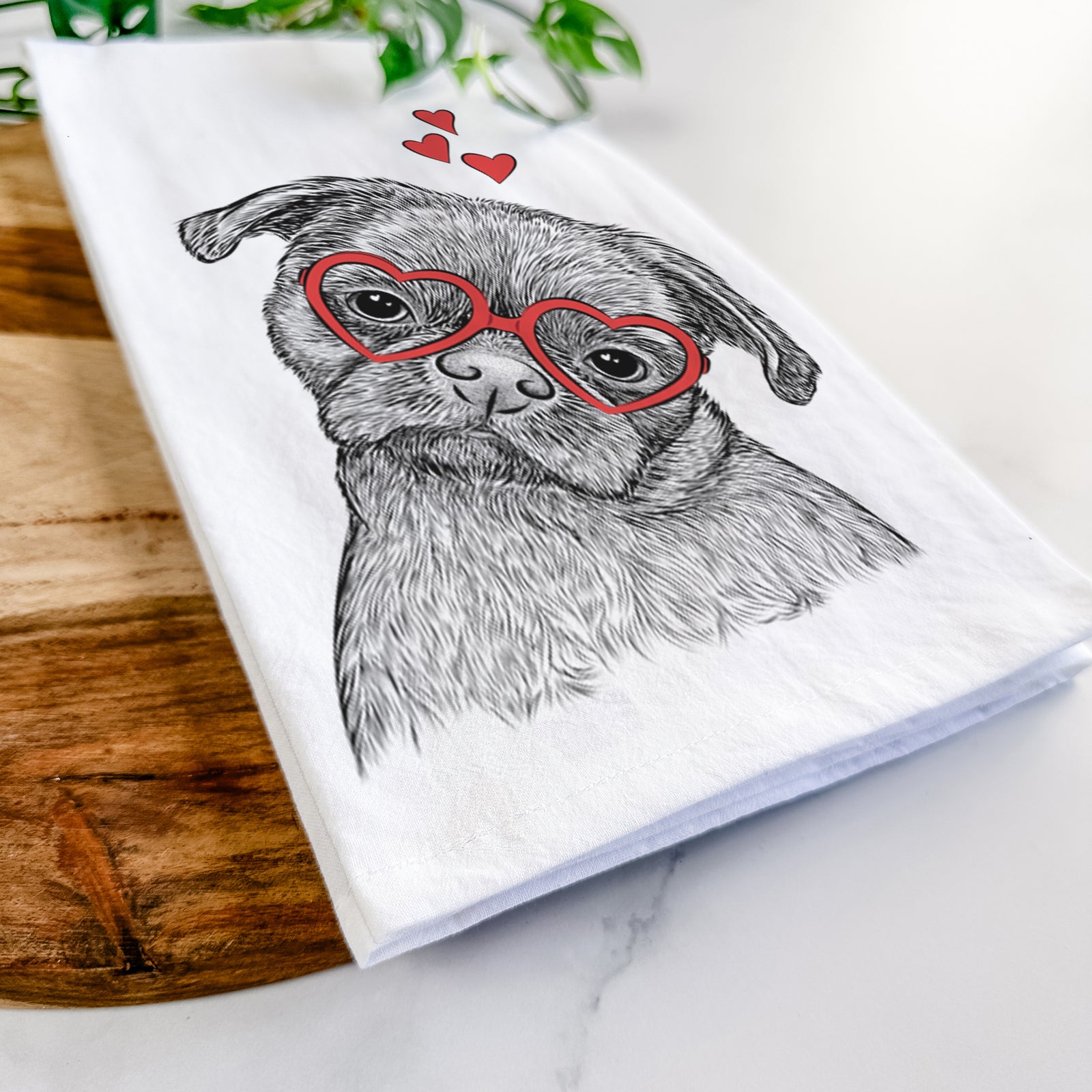 Hand-drawn sketch of Koko the Shih Tzu wearing heart-shaped glasses on a tea towel
