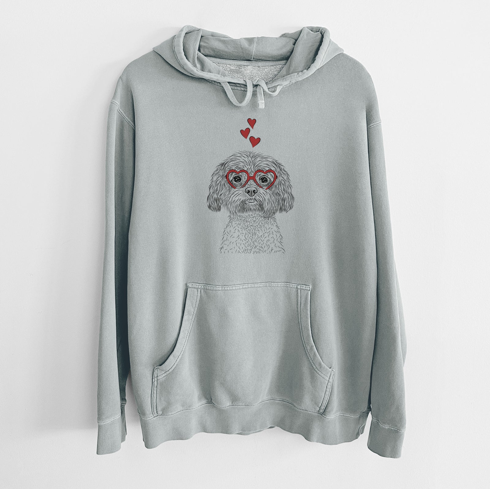 Hand-drawn sketch of Lane the Lhasa Apso wearing heart-shaped glasses on a Sage Unisex pigment dyed hoodie