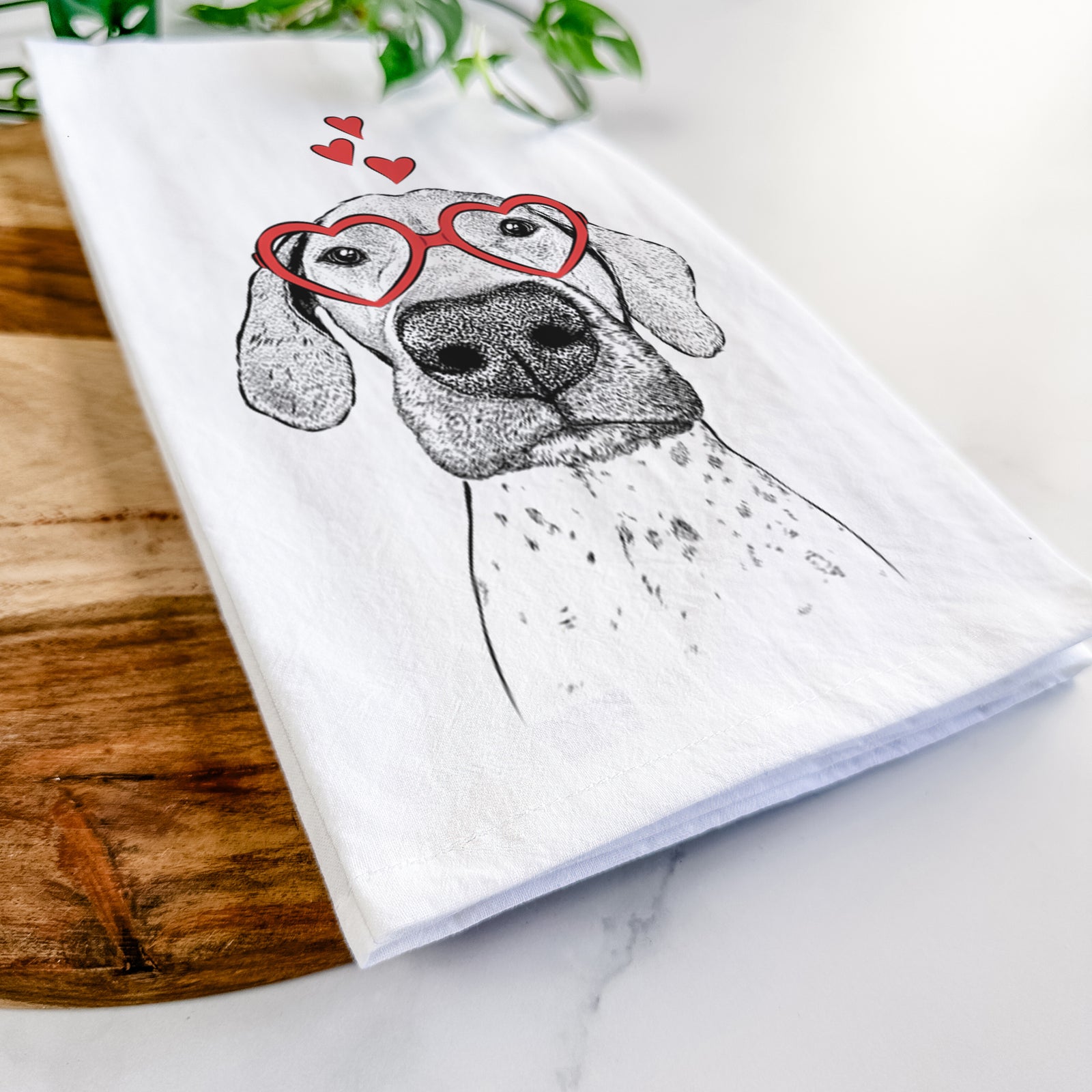 Hand-drawn sketch of Leroy the German Shorthaired Pointer wearing heart-shaped glasses on a tea towel