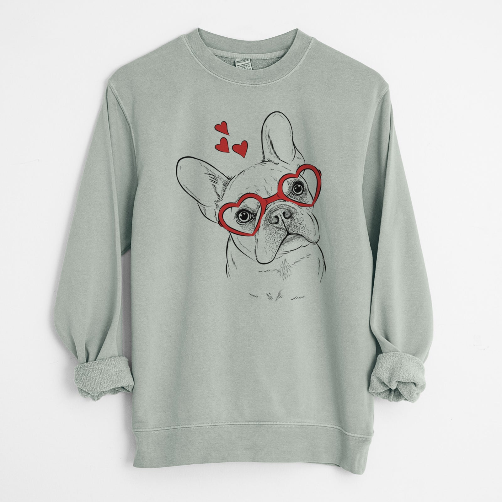 Hand-drawn sketch of Loki the French Bulldog wearing heart-shaped glasses on a Sage Unisex pigment dyed crew sweatshirt