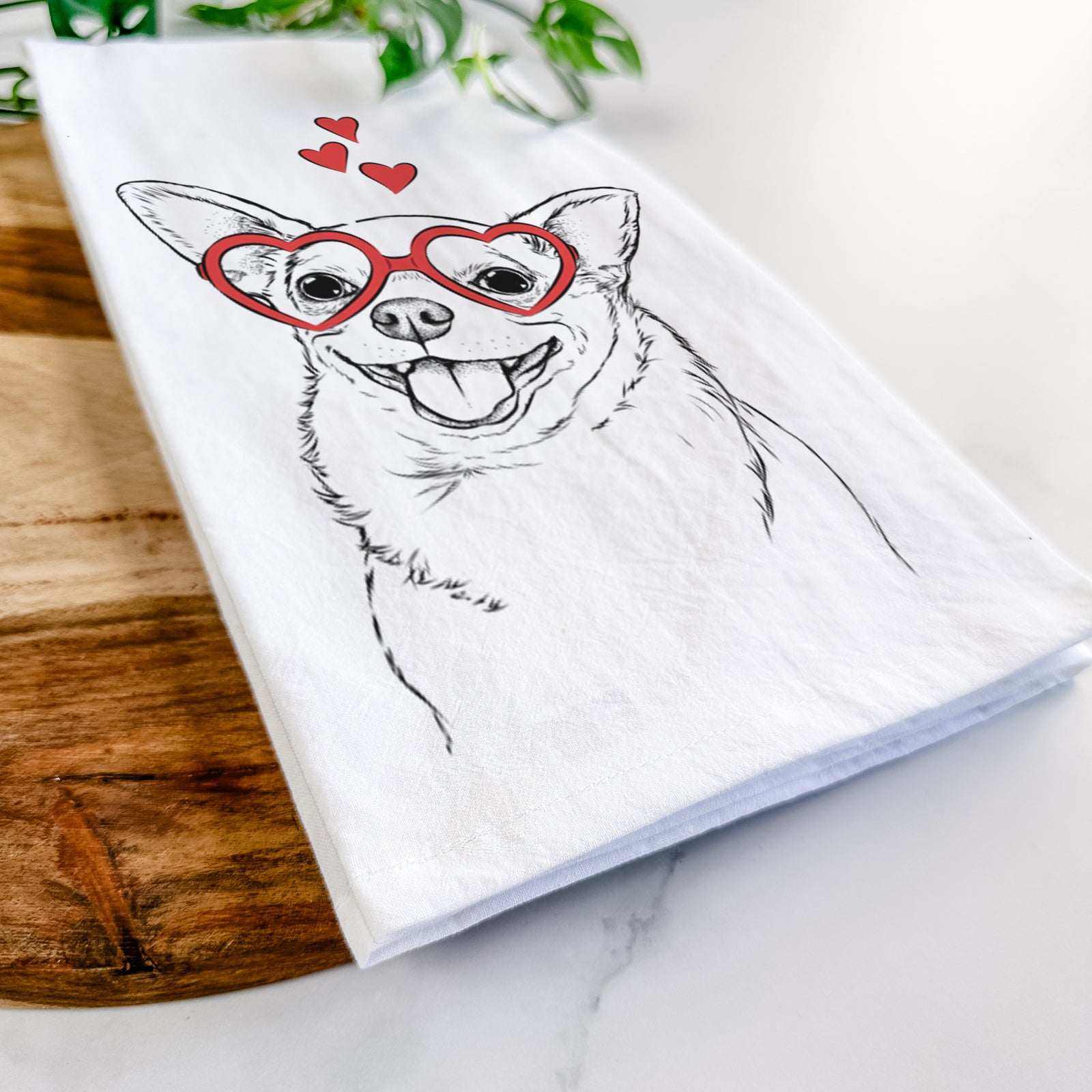 Hand-drawn sketch of Maddison Pearl the Chihuahua wearing heart-shaped glasses on a tea towel