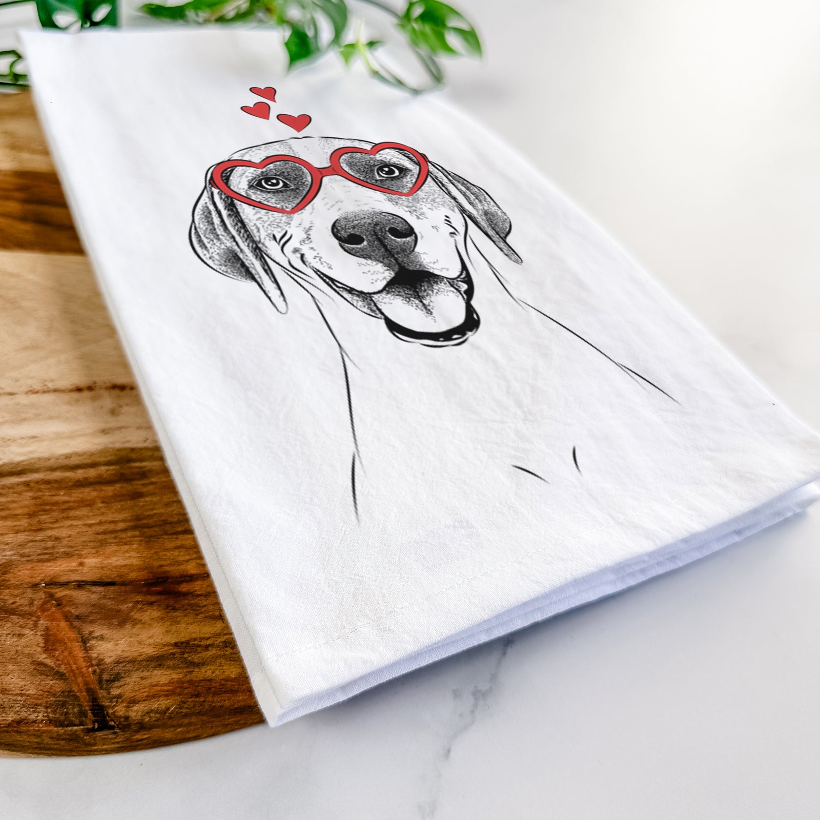 Hand-drawn sketch of Maggie the Treeing Walker Coonhound wearing heart-shaped glasses on a tea towel