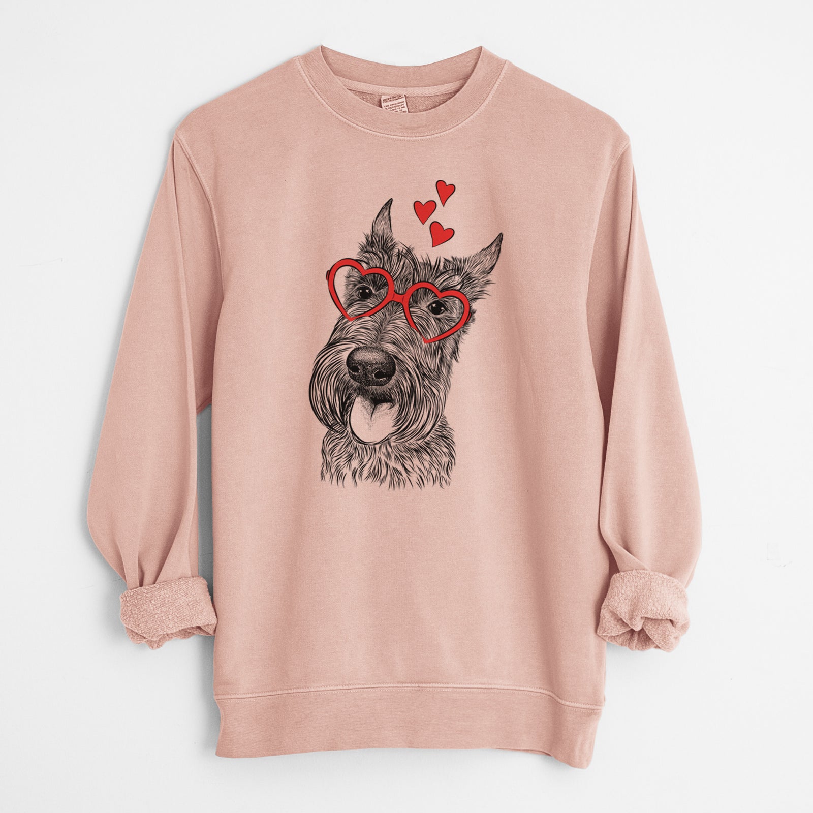 Hand-drawn sketch of Magnus the Scottish Terrier wearing heart-shaped glasses on a Dusty Pink Unisex pigment dyed crew sweatshirt