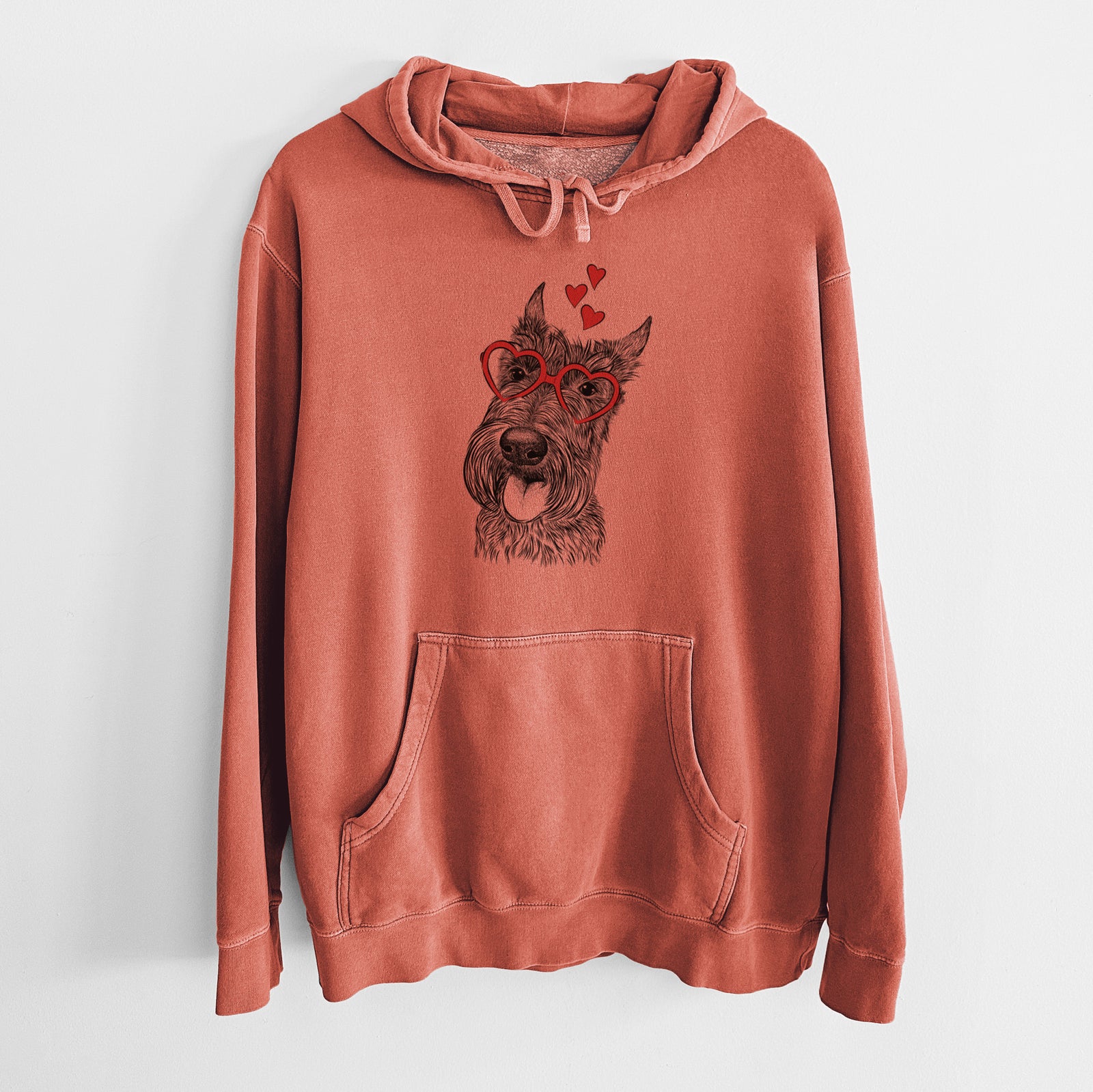 Hand-drawn sketch of Magnus the Scottish Terrier wearing heart-shaped glasses on an Amber Unisex pigment dyed hoodie