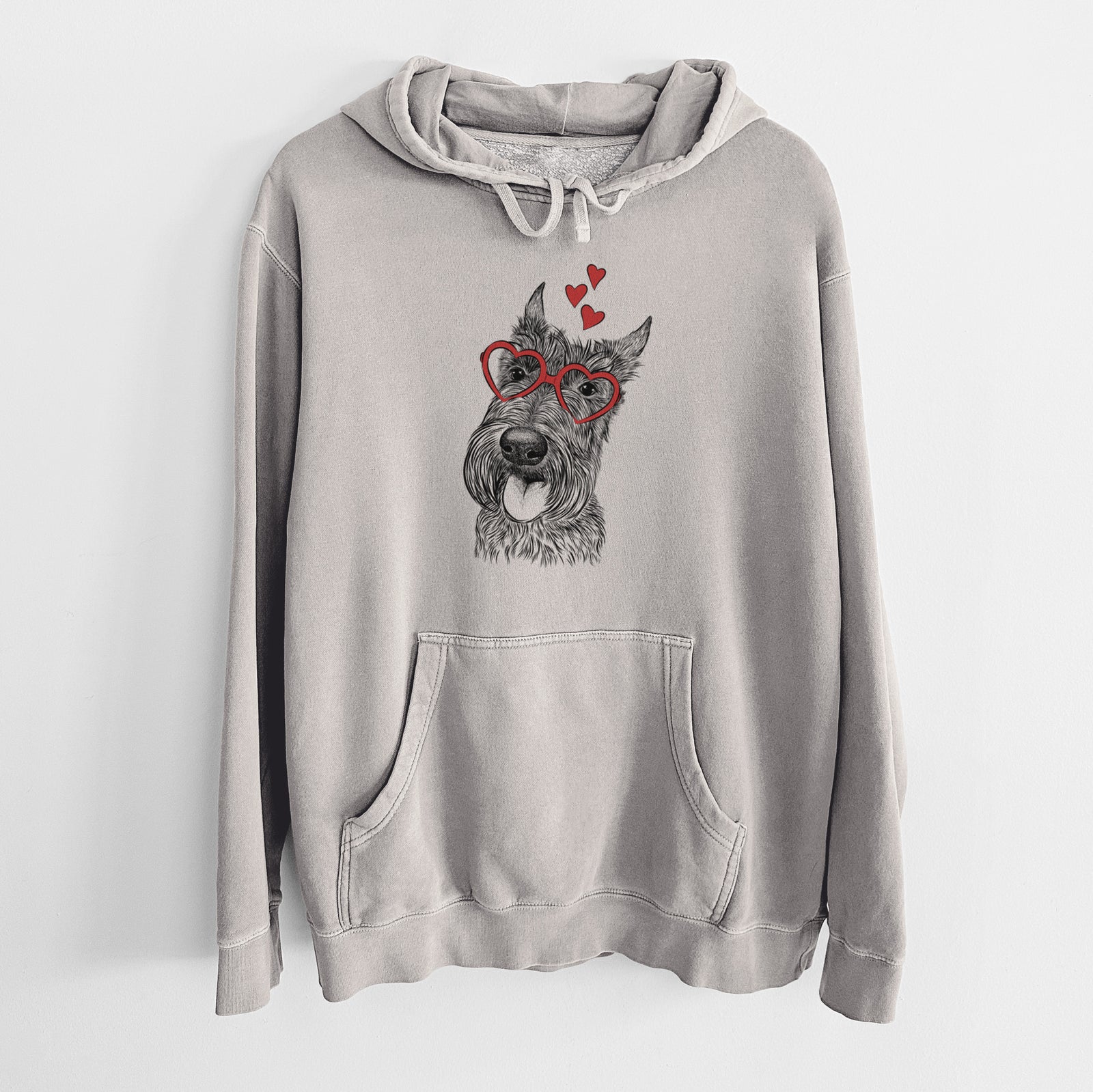 Hand-drawn sketch of Magnus the Scottish Terrier wearing heart-shaped glasses on a Cement Unisex pigment dyed hoodie