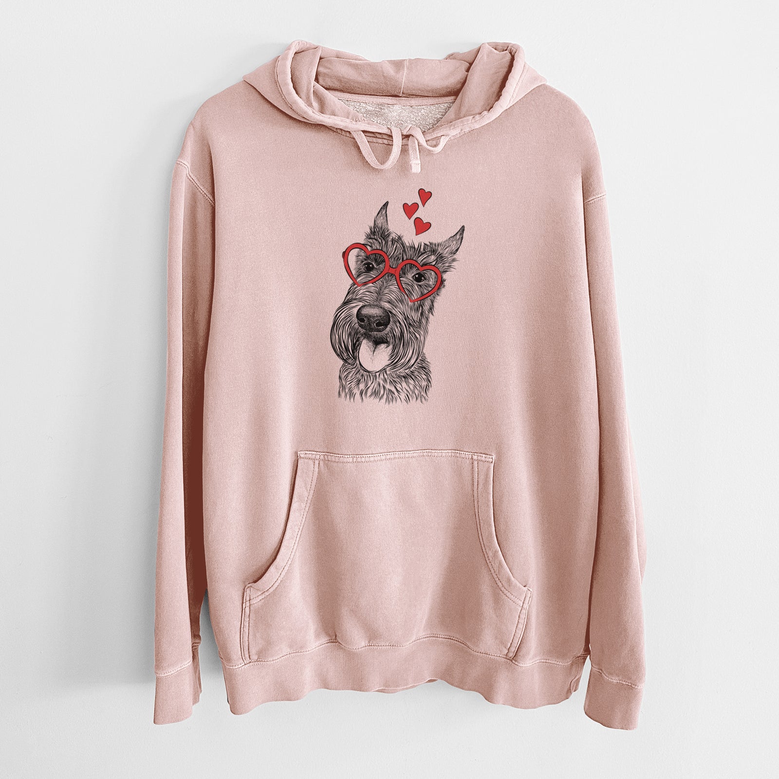 Hand-drawn sketch of Magnus the Scottish Terrier wearing heart-shaped glasses on a Dusty Pink Unisex pigment dyed hoodie