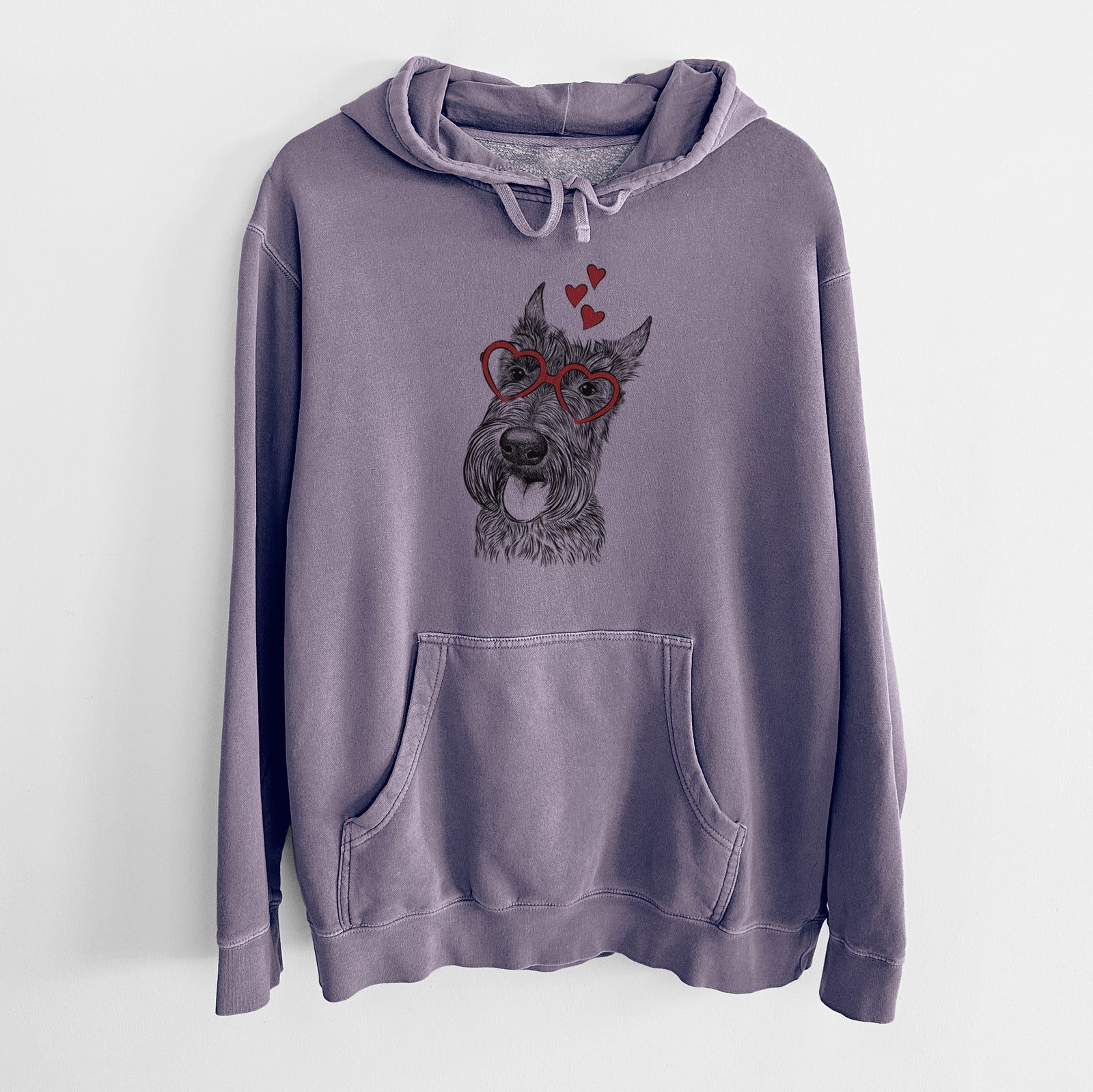 Hand-drawn sketch of Magnus the Scottish Terrier wearing heart-shaped glasses on a Plum Unisex pigment dyed hoodie