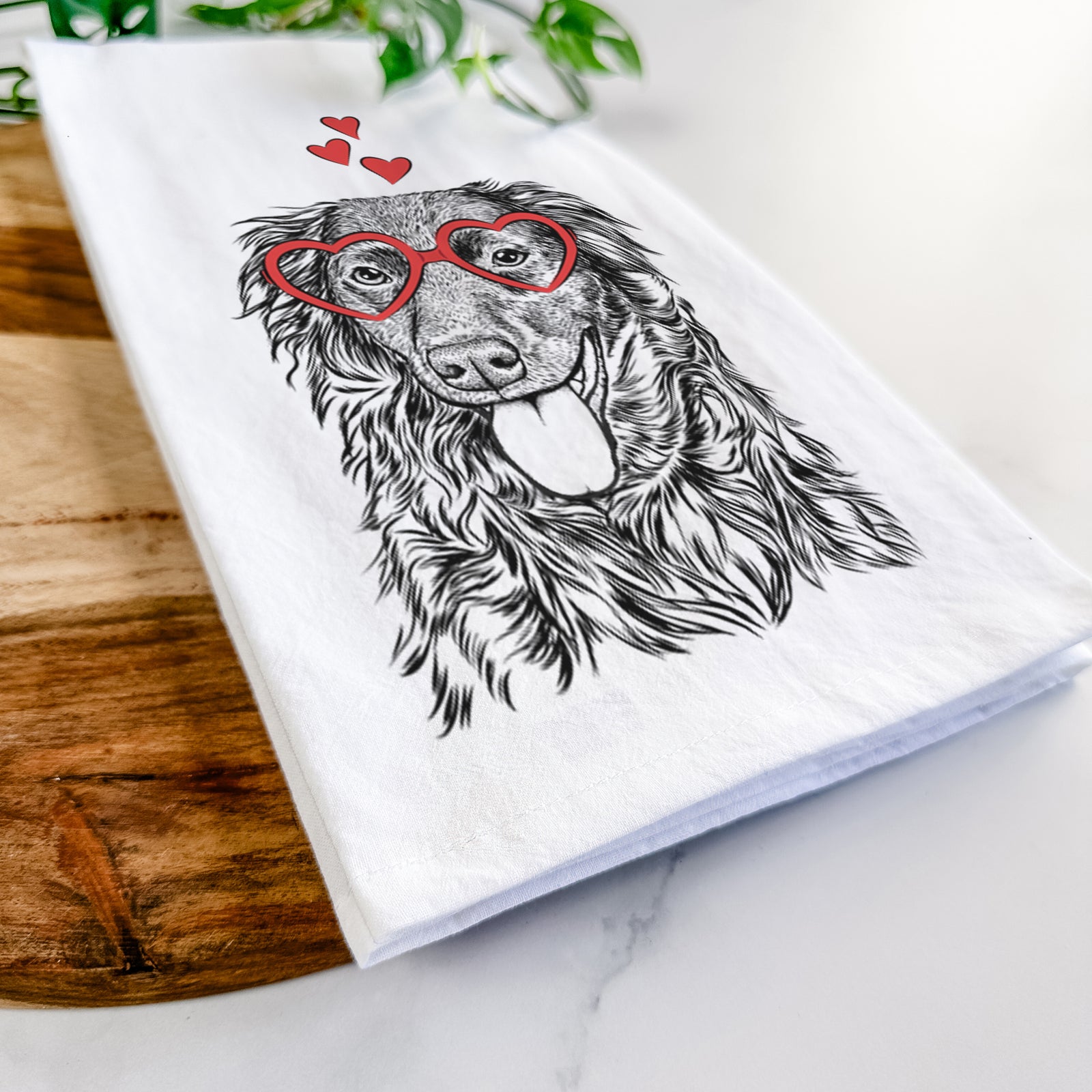 Hand-drawn sketch of Maisie Mae the Aussiedor wearing heart-shaped glasses on a tea towel