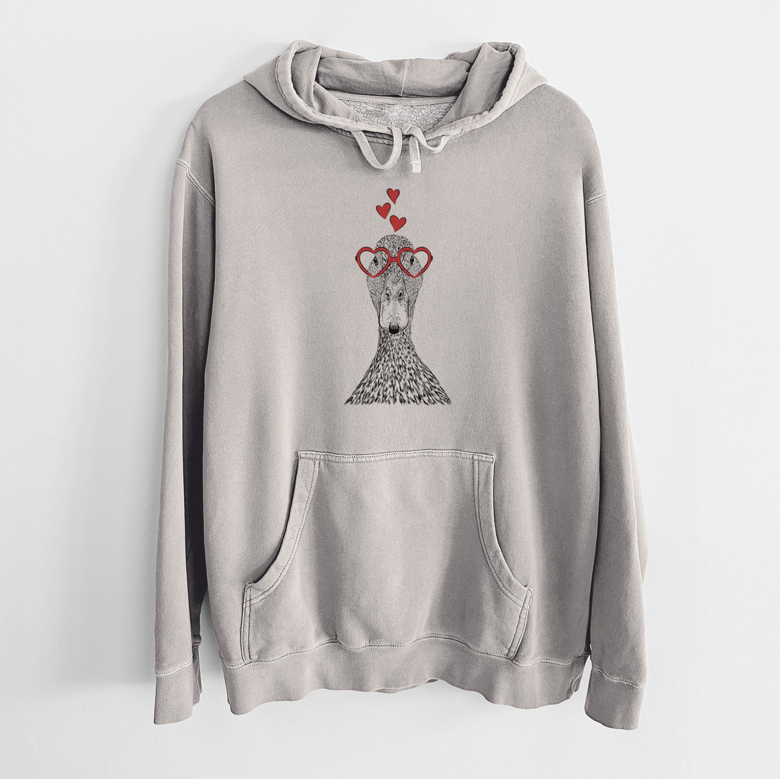 Hand-drawn sketch of Marge the Mallard Duck wearing heart-shaped glasses on a Cement Unisex pigment dyed hoodie