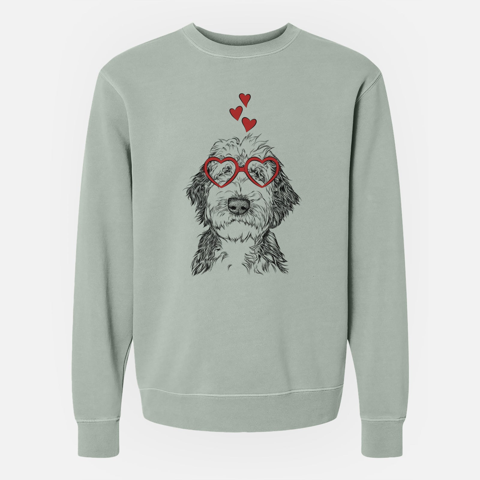 Hand-drawn sketch of Milo Fluff the Sheepadoodle wearing heart-shaped glasses on a Sage Unisex pigment dyed crew sweatshirt