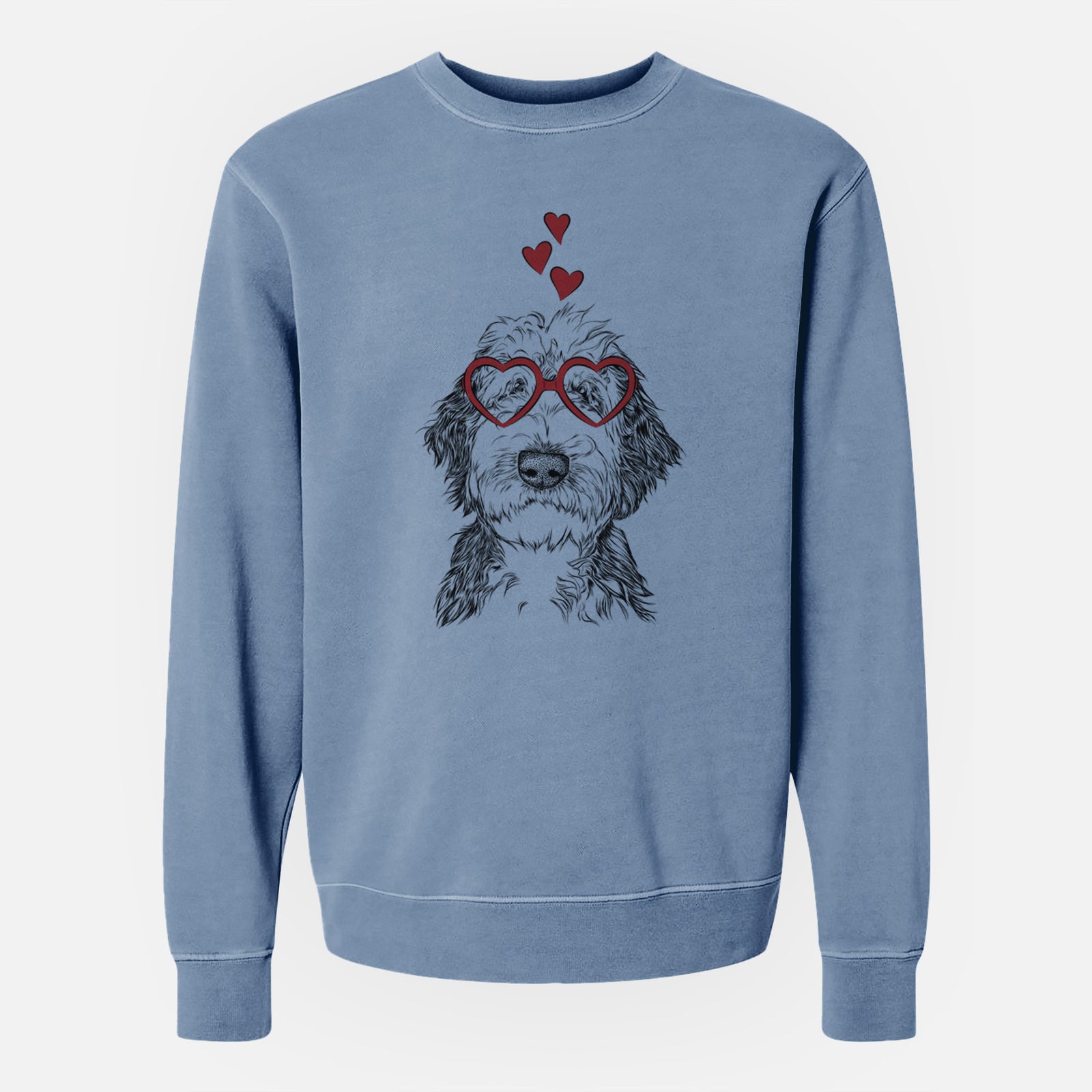 Hand-drawn sketch of Milo Fluff the Sheepadoodle wearing heart-shaped glasses on a Slate Blue Unisex pigment dyed crew sweatshirt