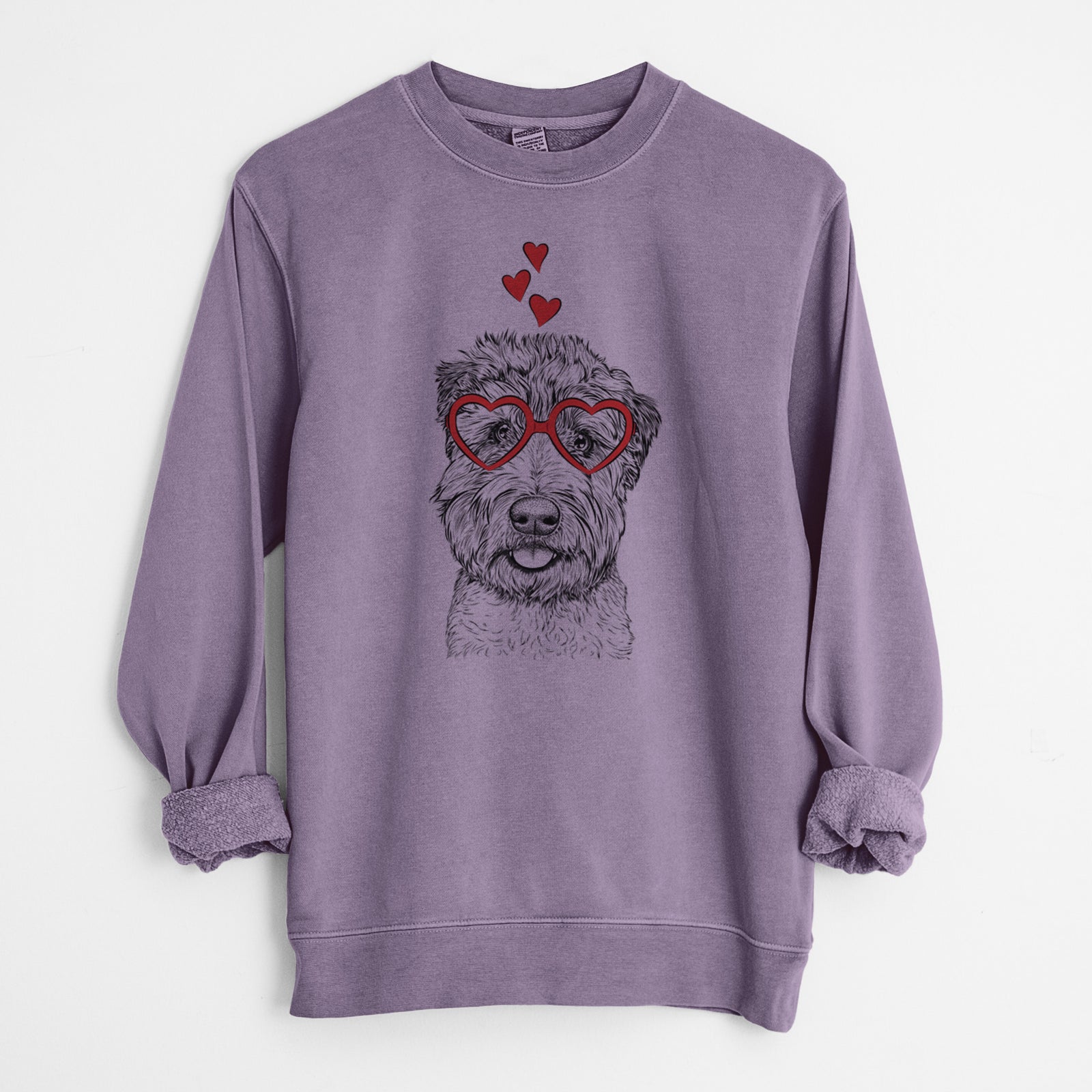 Hand-drawn sketch of Milton the Soft Coated Wheaten Terrier wearing heart-shaped glasses on a Plum Unisex pigment dyed crew sweatshirt