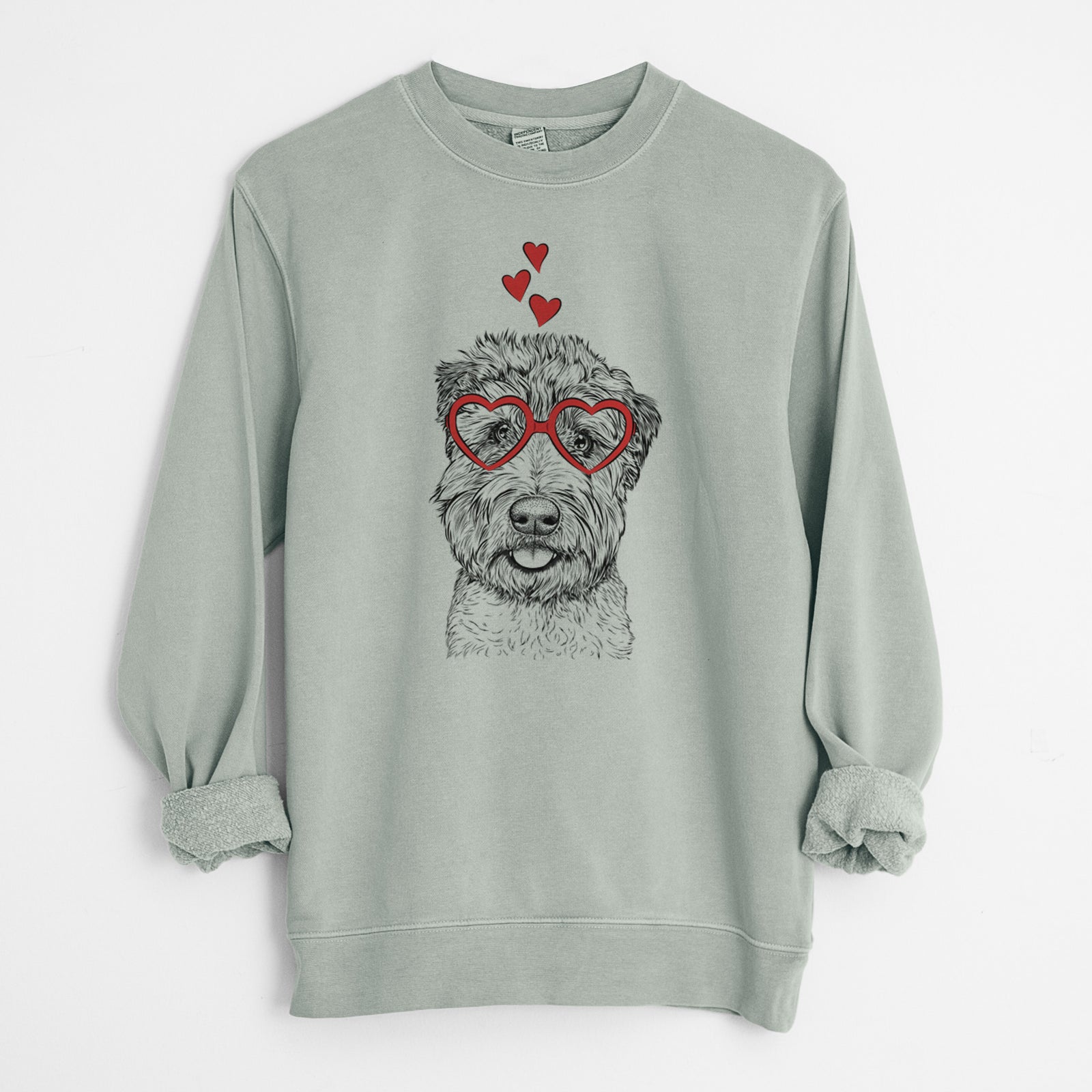 Hand-drawn sketch of Milton the Soft Coated Wheaten Terrier wearing heart-shaped glasses on a Sage Unisex pigment dyed crew sweatshirt