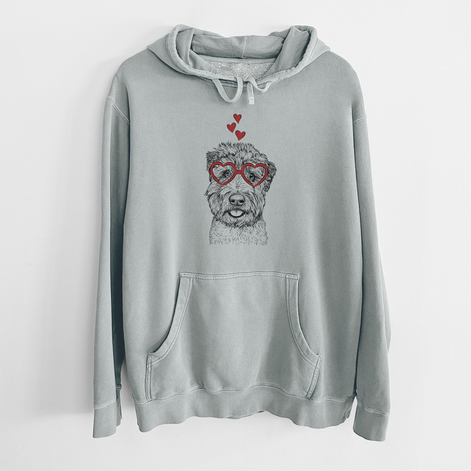 Hand-drawn sketch of Milton the Soft Coated Wheaten Terrier wearing heart-shaped glasses on a Sage Unisex pigment dyed hoodie