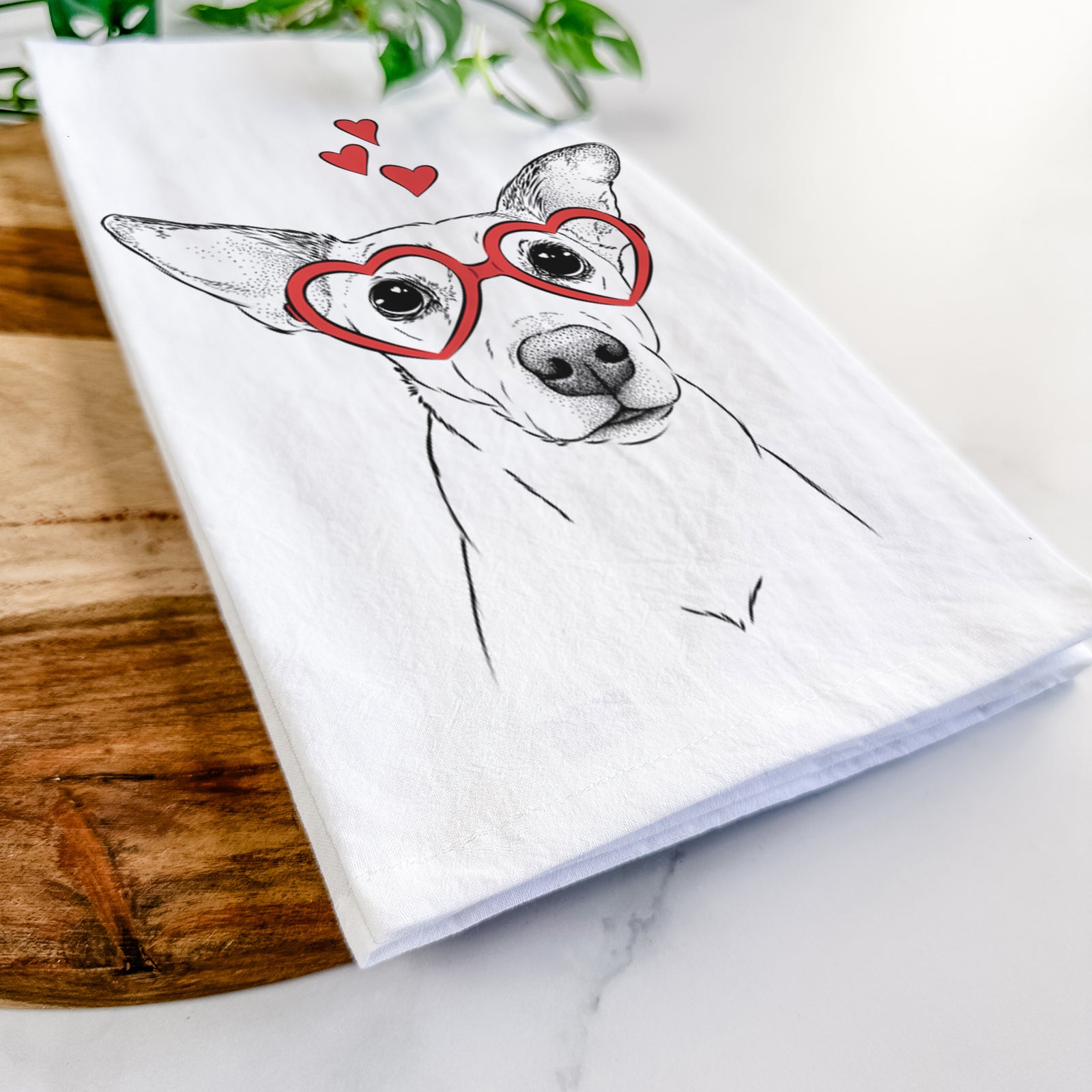 Hand-drawn sketch of Molly the Jack Russell Terrier wearing heart-shaped glasses on a tea towel