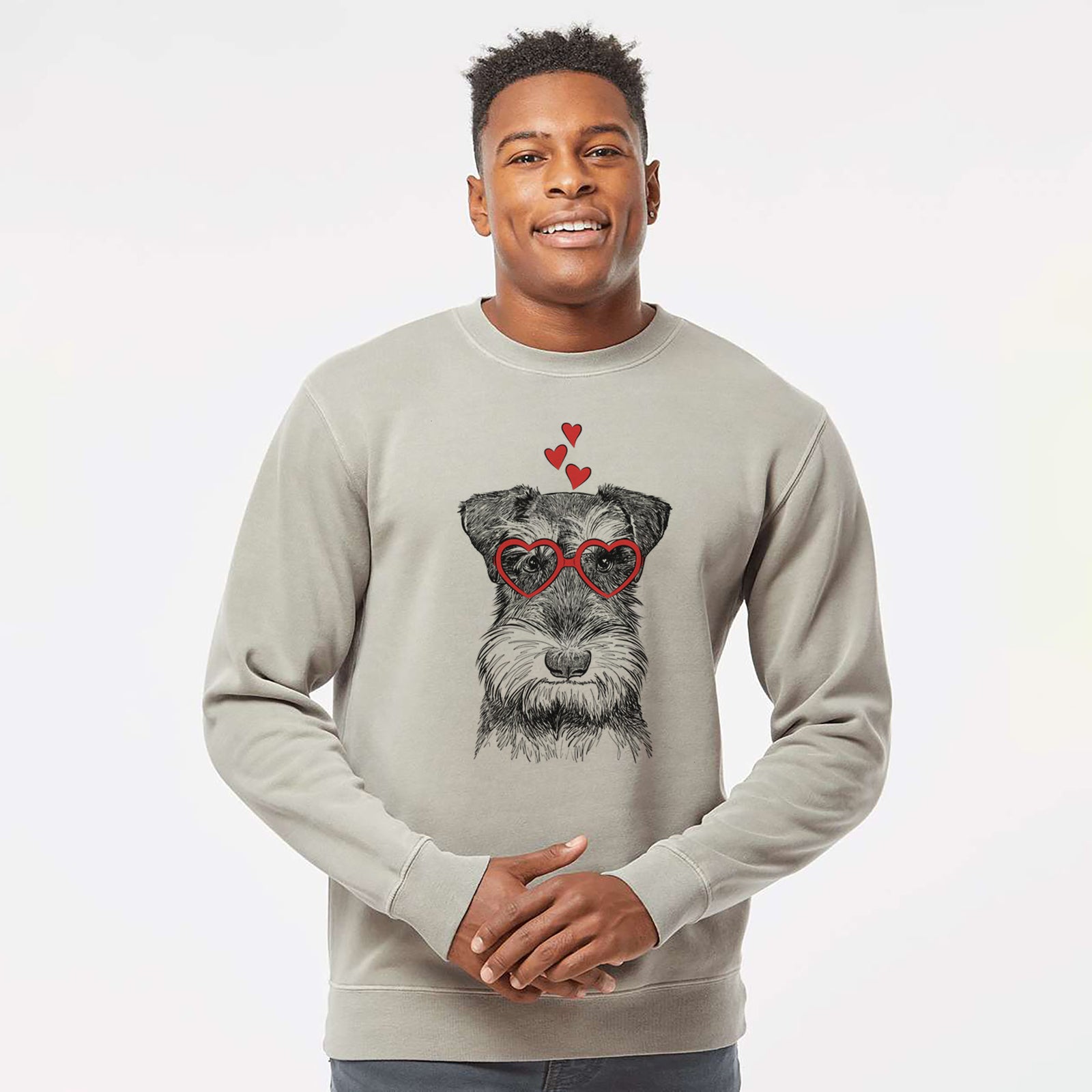 Hand-drawn sketch of Murphy the Mini Schnauzer wearing heart-shaped glasses on a Cement Unisex pigment dyed crew sweatshirt