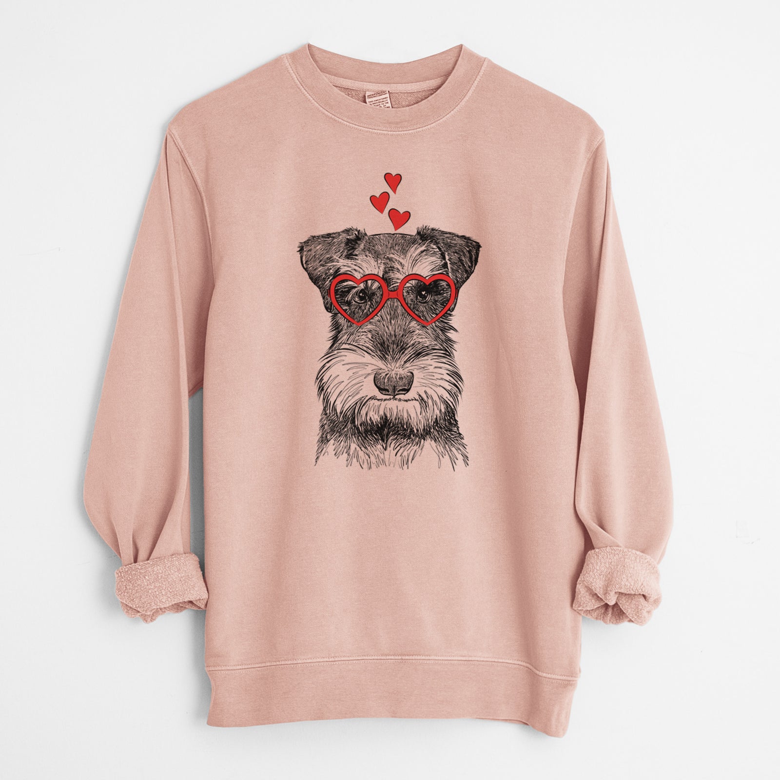 Hand-drawn sketch of Murphy the Mini Schnauzer wearing heart-shaped glasses on a Dusty Pink Unisex pigment dyed crew sweatshirt