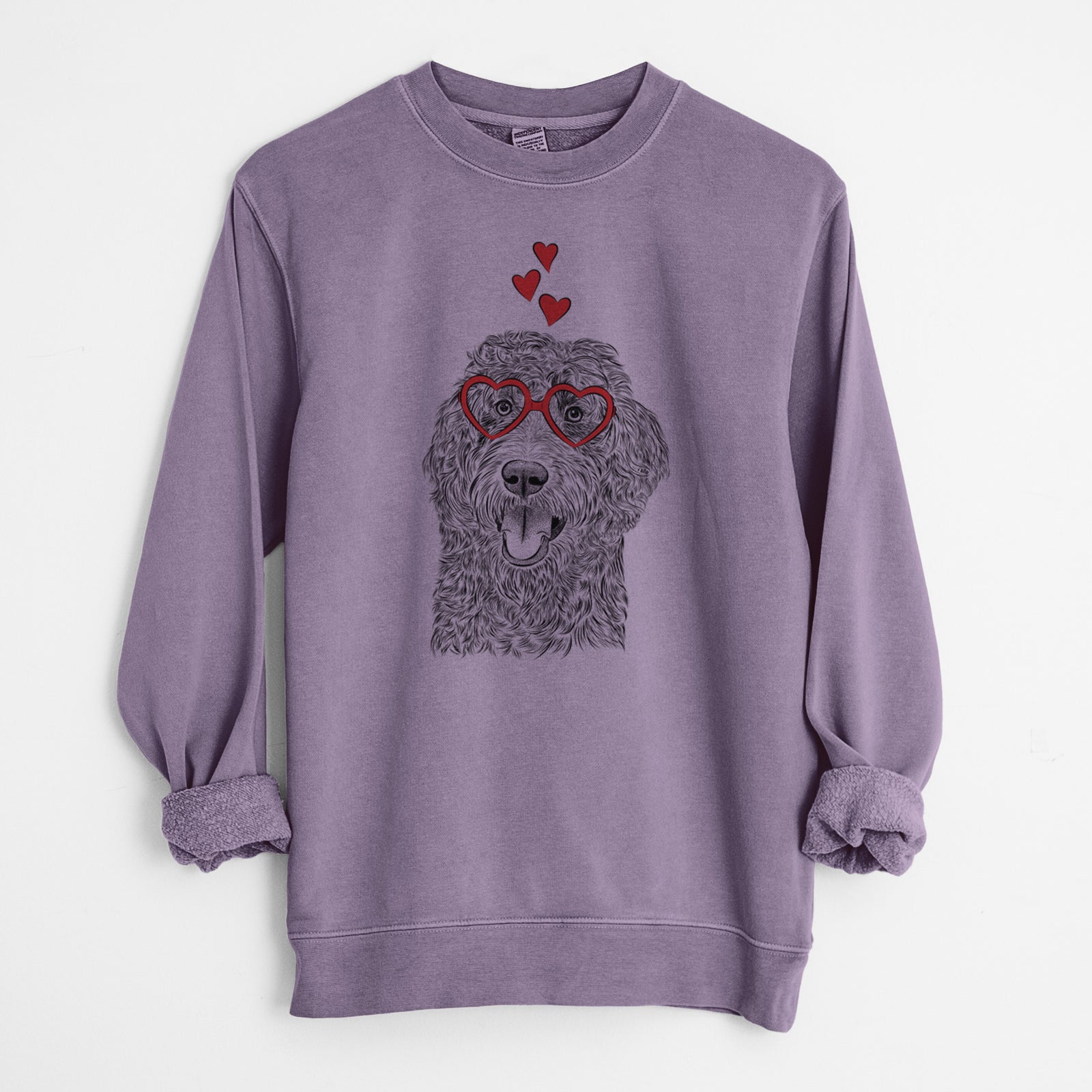 Hand-drawn sketch of Murr Dog the Labradoodle wearing heart-shaped glasses on a Plum Unisex pigment dyed crew sweatshirt