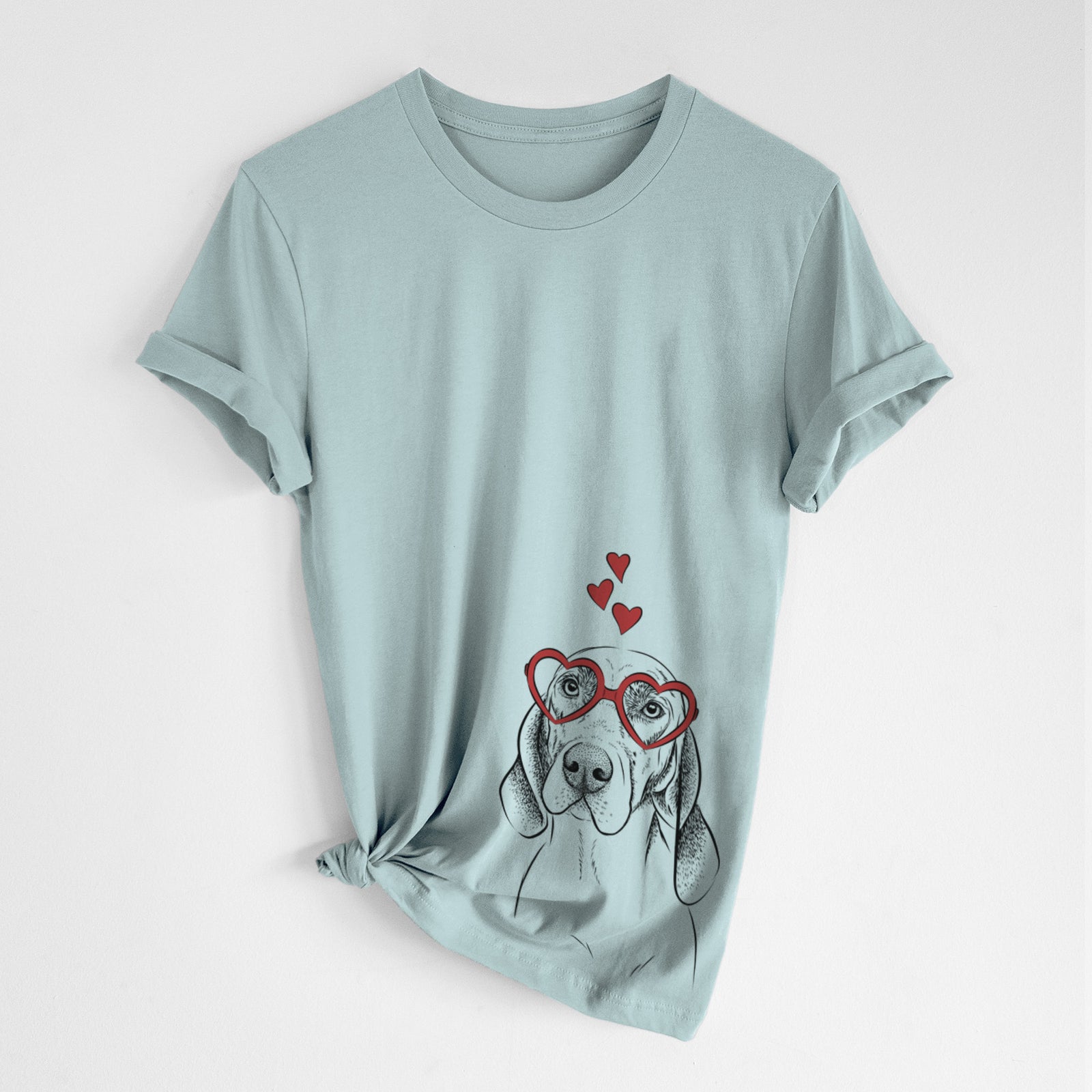 Hand-drawn sketch of Norman the Plott Hound wearing heart-shaped glasses on a Dusty Blue Unisex crewneck, worn by a woman