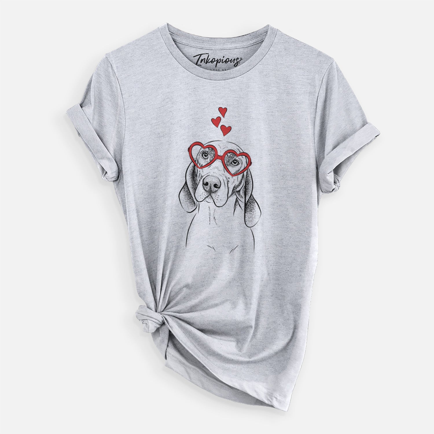 Hand-drawn sketch of Norman the Plott Hound wearing heart-shaped glasses on a Grey Unisex crewneck, worn by a woman