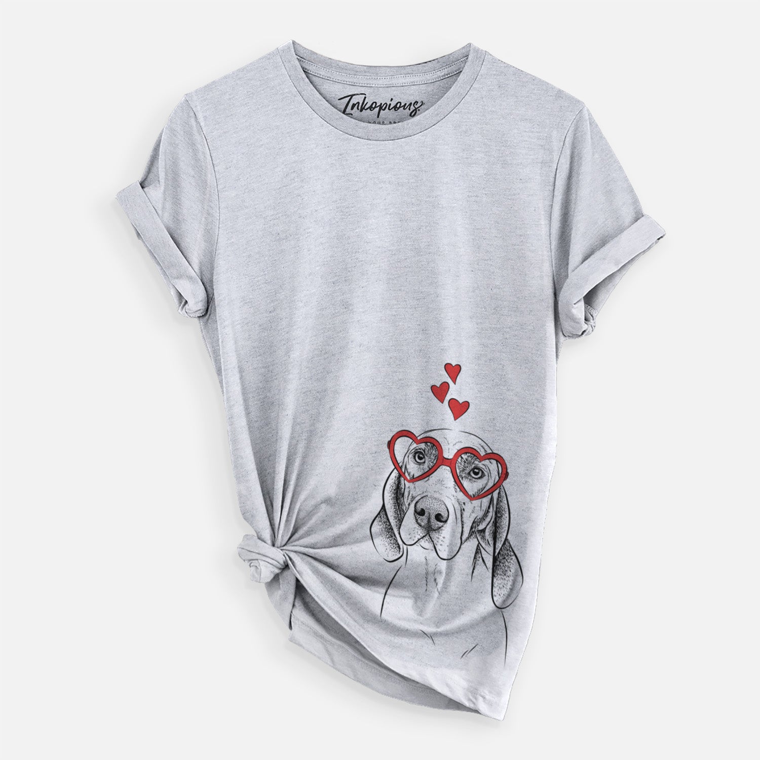 Hand-drawn sketch of Norman the Plott Hound wearing heart-shaped glasses on a Grey Unisex crewneck, worn by a woman