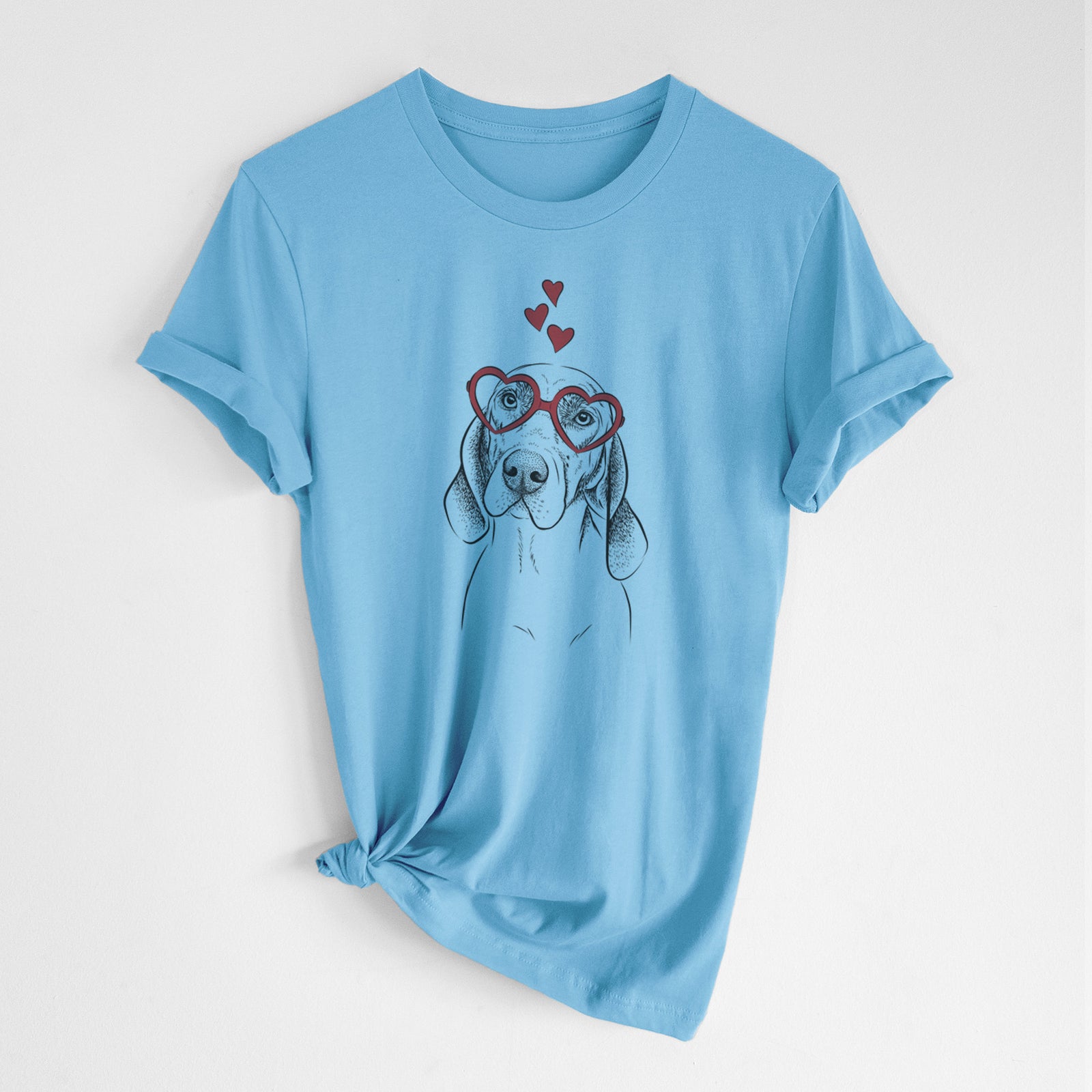 Hand-drawn sketch of Norman the Plott Hound wearing heart-shaped glasses on an Ocean Blue Unisex crewneck, worn by a woman