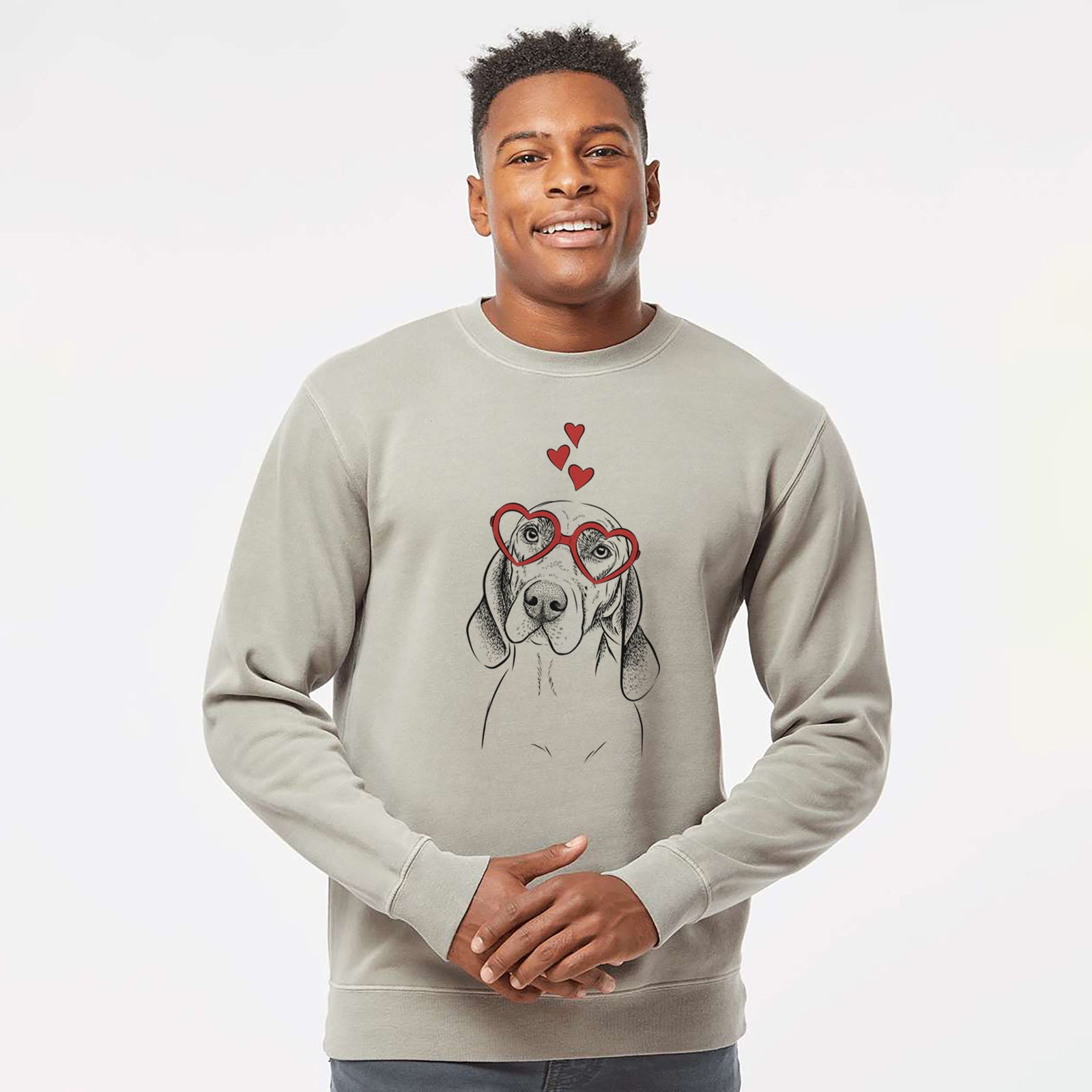 Hand-drawn sketch of Norman the Plott Hound wearing heart-shaped glasses on a Cement Unisex pigment dyed crew sweatshirt
