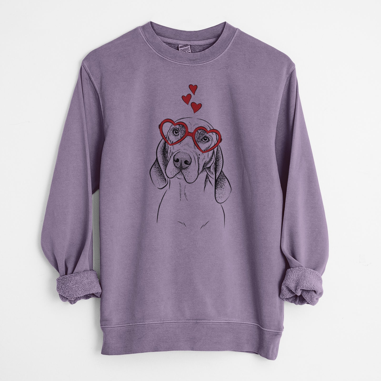 Hand-drawn sketch of Norman the Plott Hound wearing heart-shaped glasses on a Plum Unisex pigment dyed crew sweatshirt