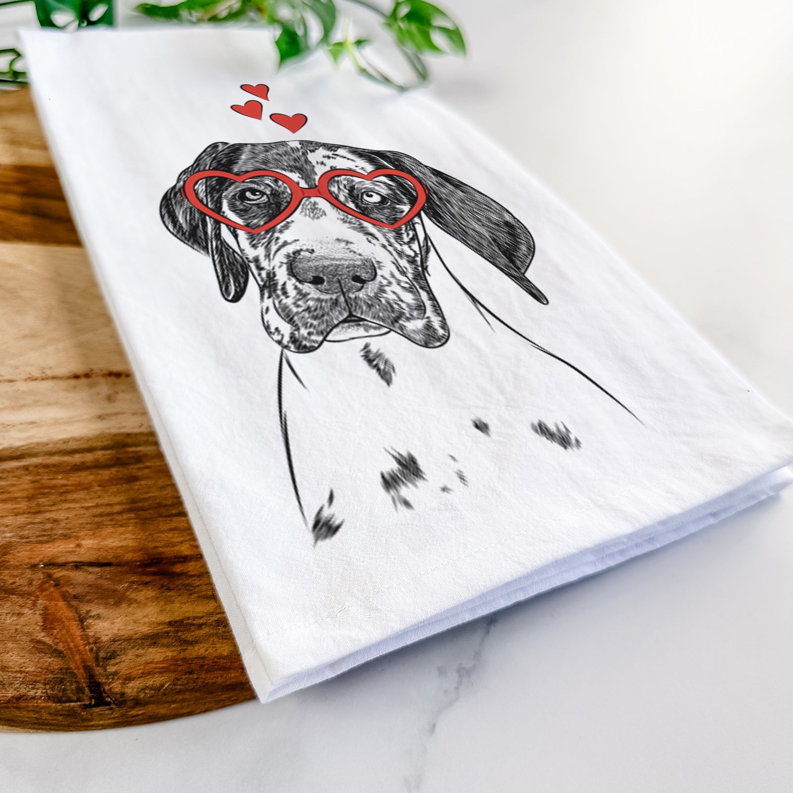 Hand-drawn sketch of Nyx the Great Dane wearing heart-shaped glasses on a tea towel