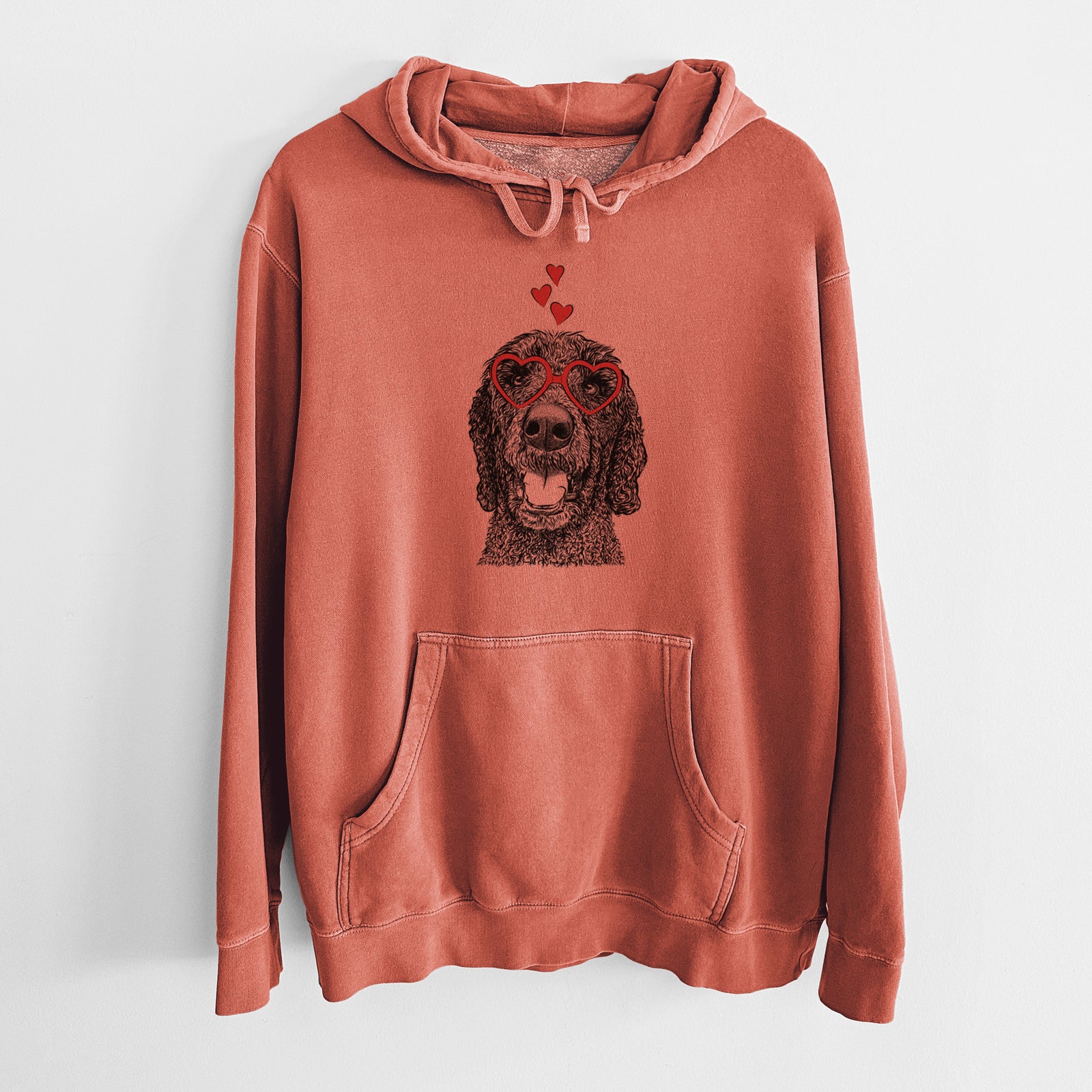 Hand-drawn sketch of Obi James the Goldendoodle wearing heart-shaped glasses on an Amber Unisex pigment dyed hoodie